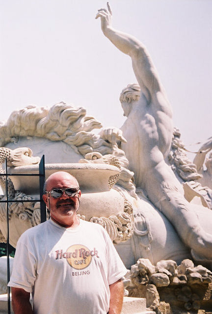 David Soileau poses in front of Neptune's Fountain