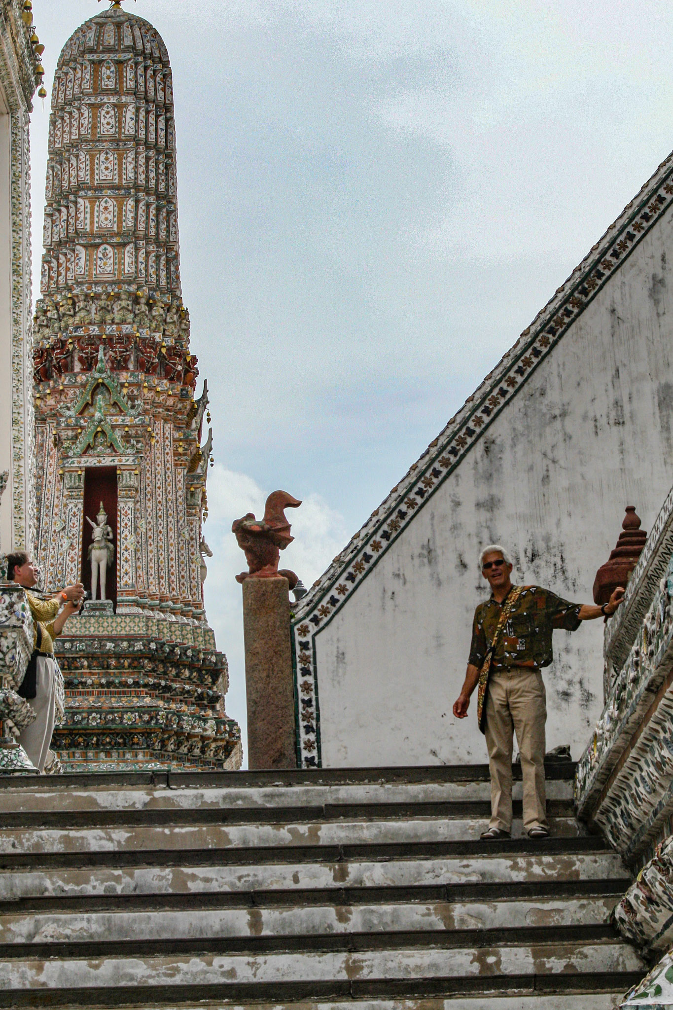Robert Huesca stops to smile at the camera at Wat Arun, Bangkok, Thailand.