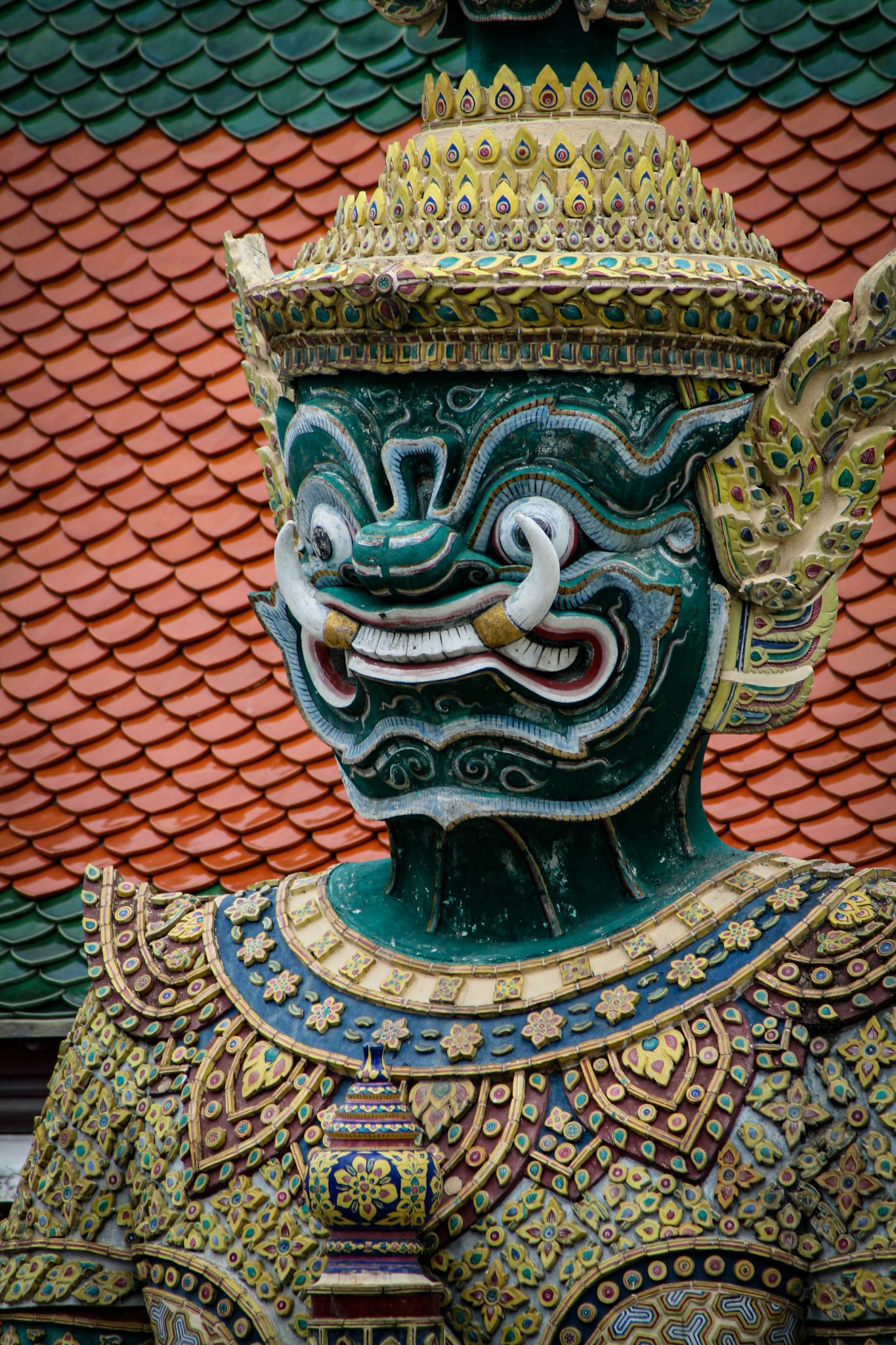 Six pairs of giant demon guardians flank all entrances to the Temple of the Emerald Buddha in Bangkok, Thailand. They are known as yaksha or in Thai are simply called yak (giant) and they are Buddhist gods that protect against evil spirits. The yaksha were placed there during the reign of Rama III. 