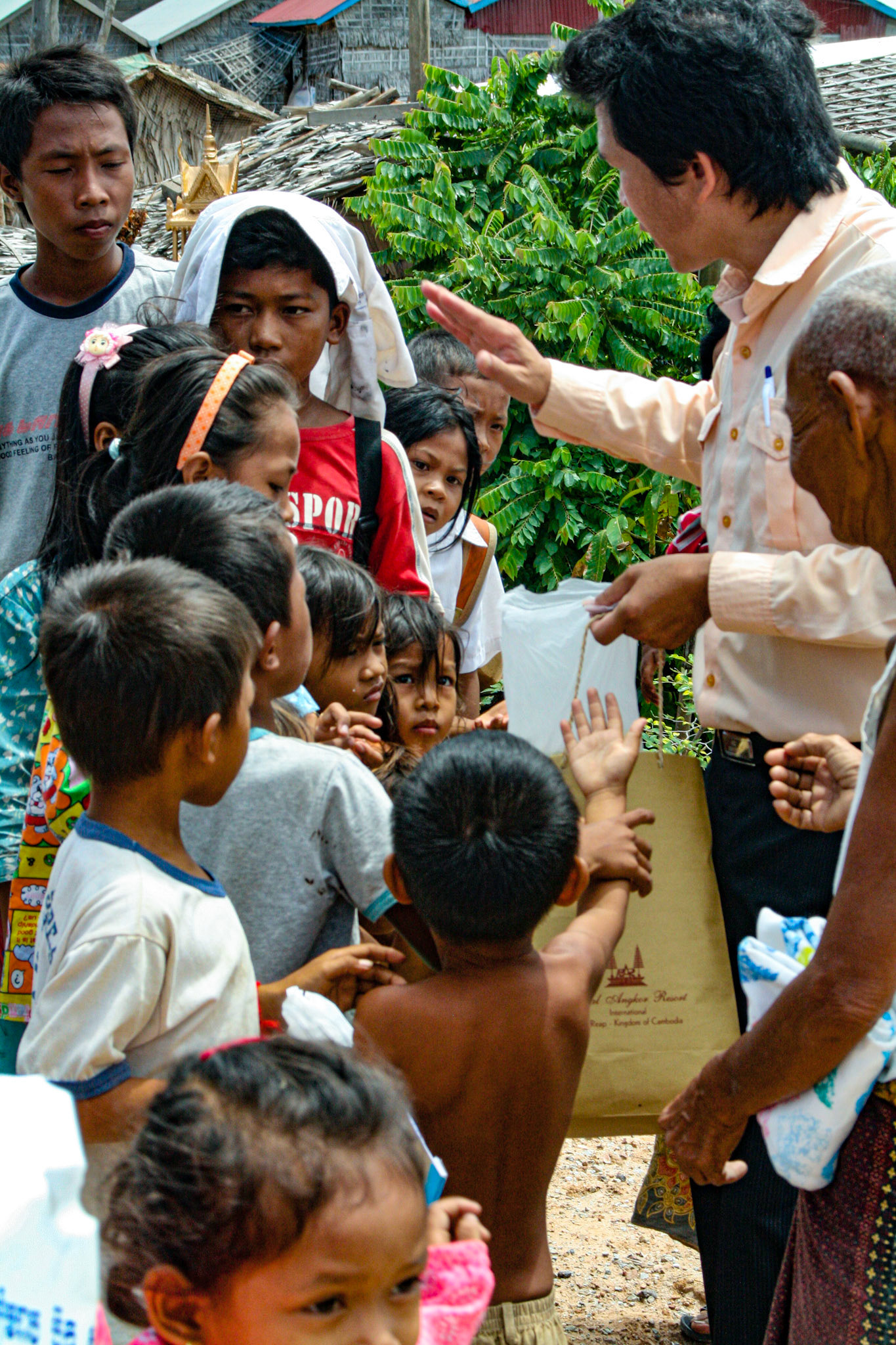 Our tour guide delivers varied and sundry gifts to some local villagers. Clothes, hygiene products, paper goods and other small items are among some of the items he collects for each time he visits. 