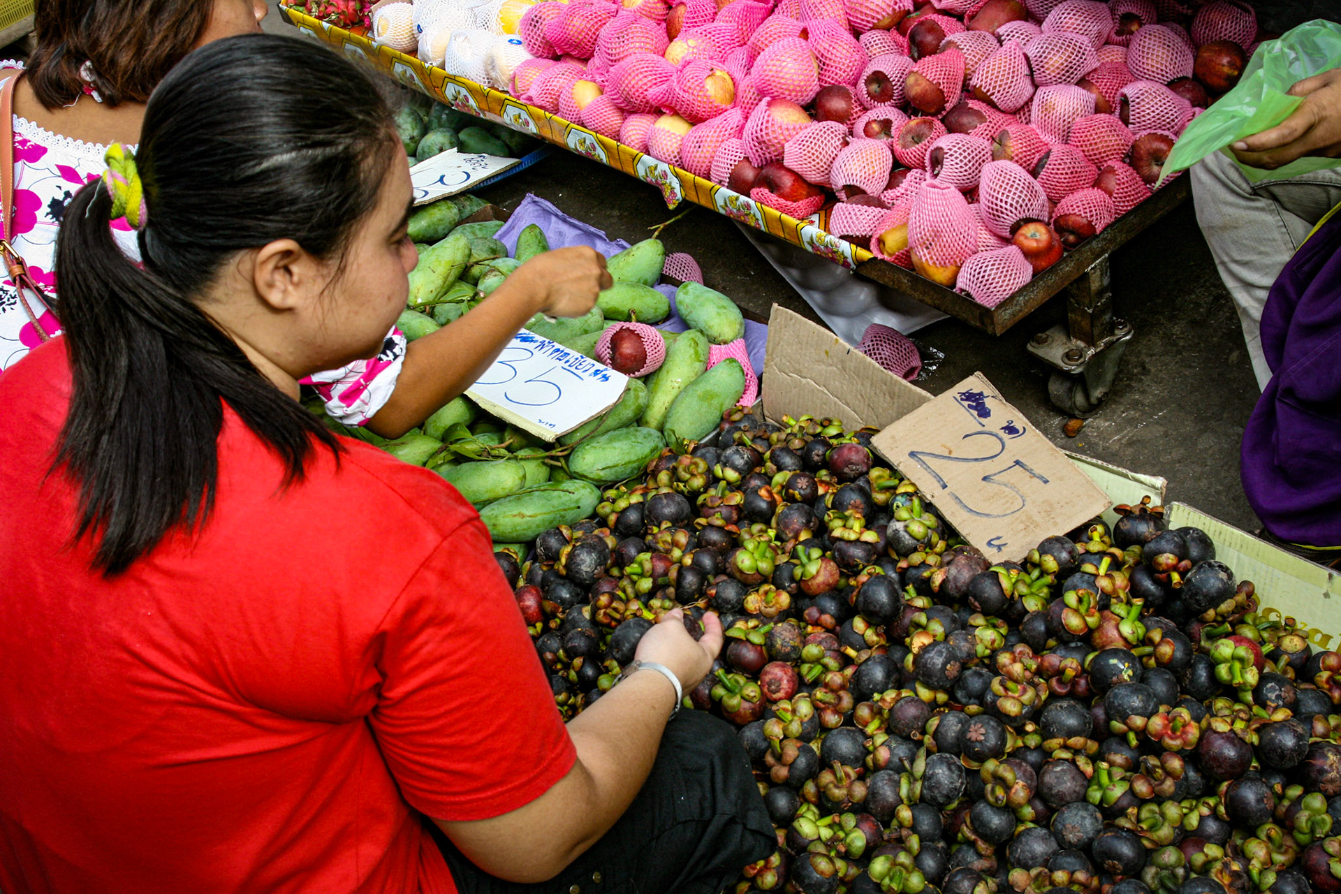 Maeklong Railway Market, located in Samut Songkhram, Thailand, around 37 mi west of Bangkok, looks like any other open-air market in Asia.