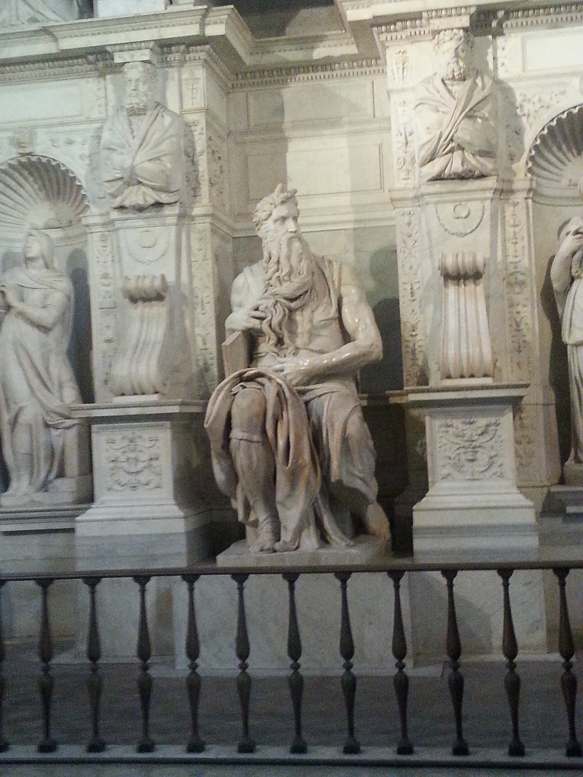 Moses (Italian: Mosè c. 1513–1515) is a sculpture by the Italian High Renaissance artist Michelangelo Buonarroti, housed in the church of San Pietro in Vincoli in Rome. Commissioned in 1505 by Pope Julius II for his tomb, it depicts the biblical figure Moses with horns on his head, based on a description in chapter 34 of Exodus in the Vulgate, the Latin translation of the Bible used at that time. 