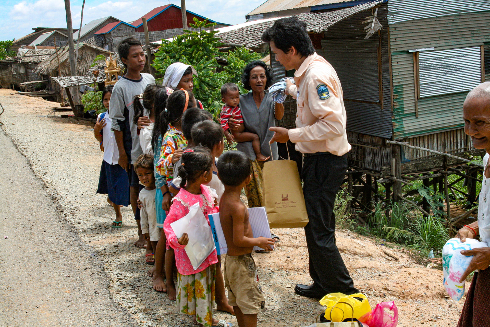 Our tour guide delivers varied and sundry gifts to some local villagers. Clothes, hygiene products, paper goods and other small items are among some of the items he collects for each time he visits. 
