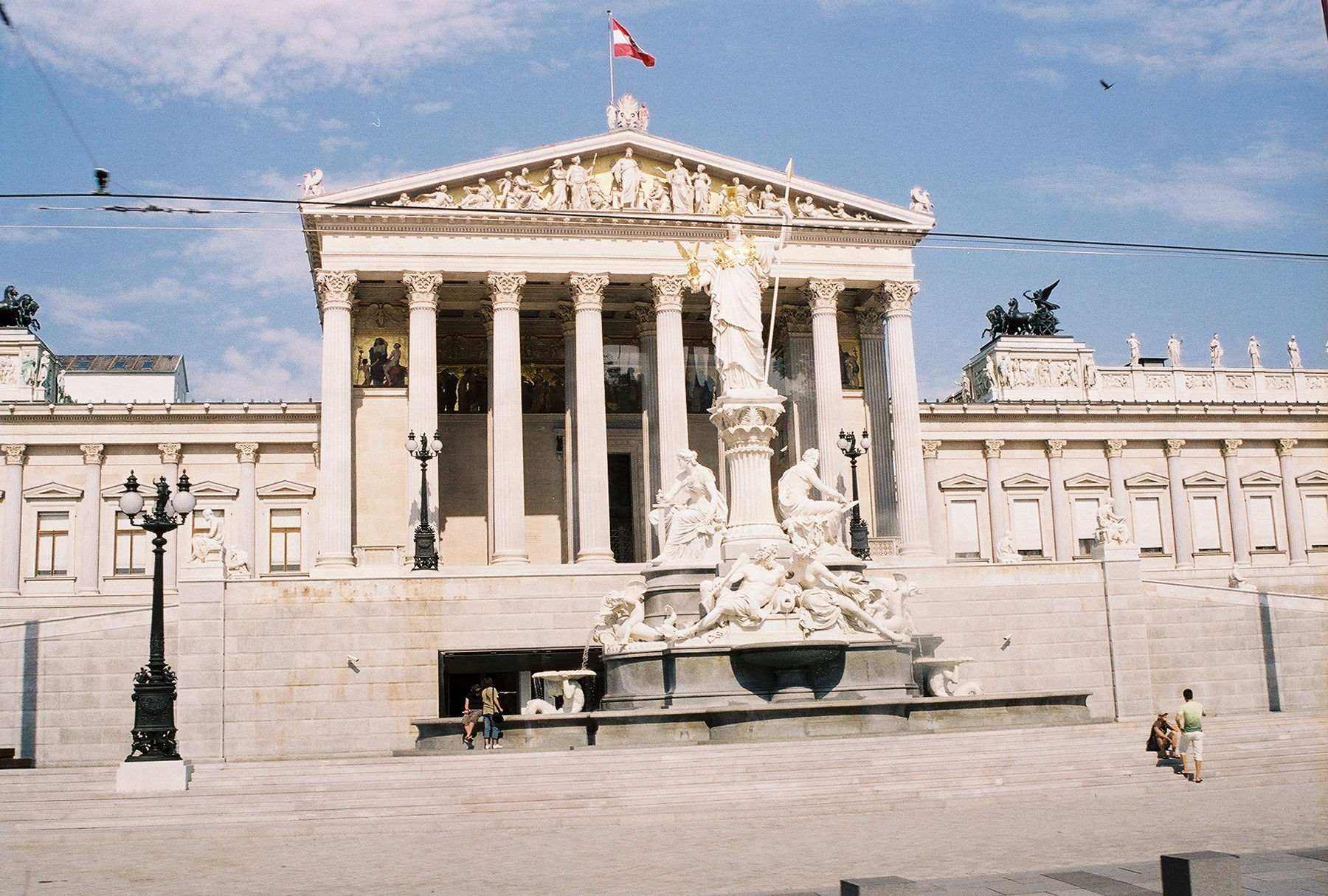 The Austrian House of Parliament, with the statue of Athena-Pallas in front, Vienna, Austria.