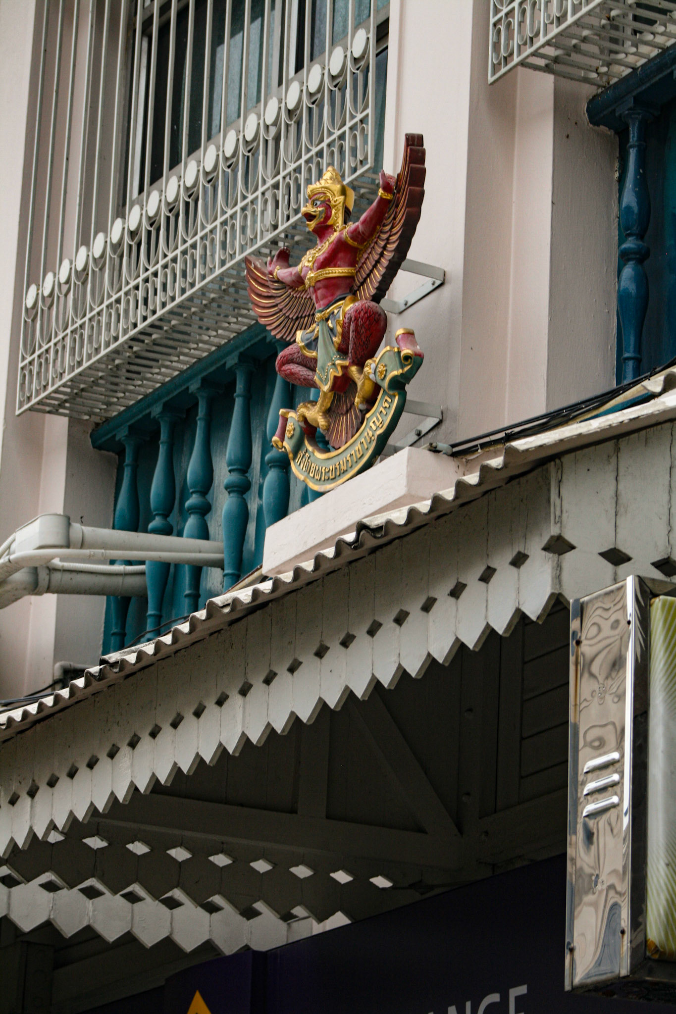 Garuda is the king of birds. Its Name derives from the root Gri, to swallow: garuda devours the snakes. He is represented with a human upper Body, big Eyes, beak, short blue horns, yellow Hair standing on end, bird's claws and wings. However, sometimes, mainly in Hindu iconography, he is represented in human Form with wings. 