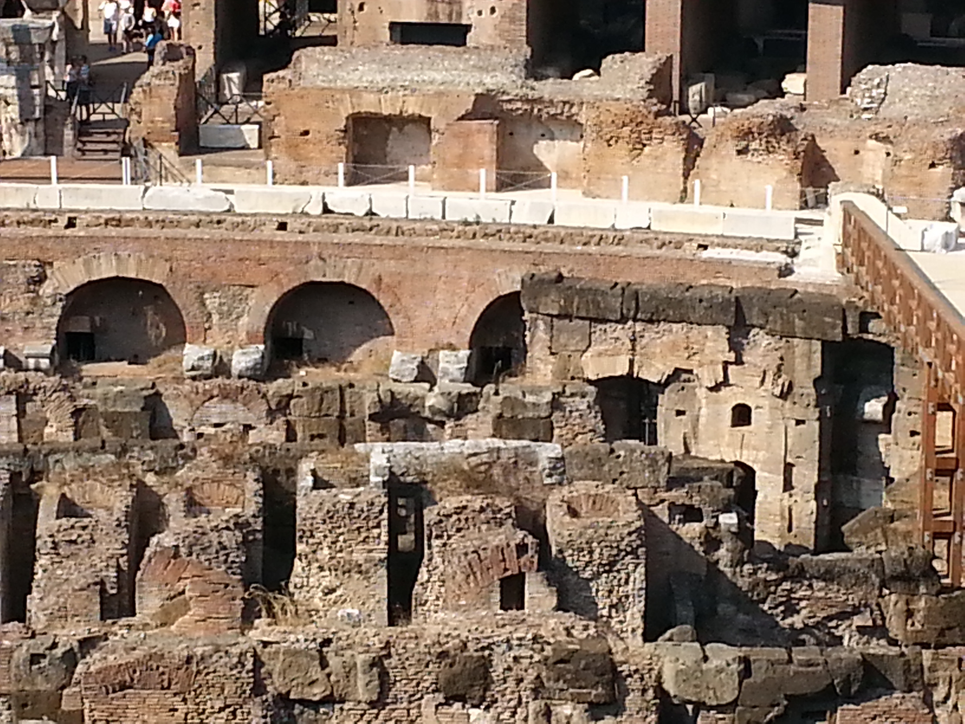 The ground level of the Colosseum is only partially constructed at one end of the amphitheater. Below that level are the chambers where they kept the gladiators and various beasts before the slaughter began. 