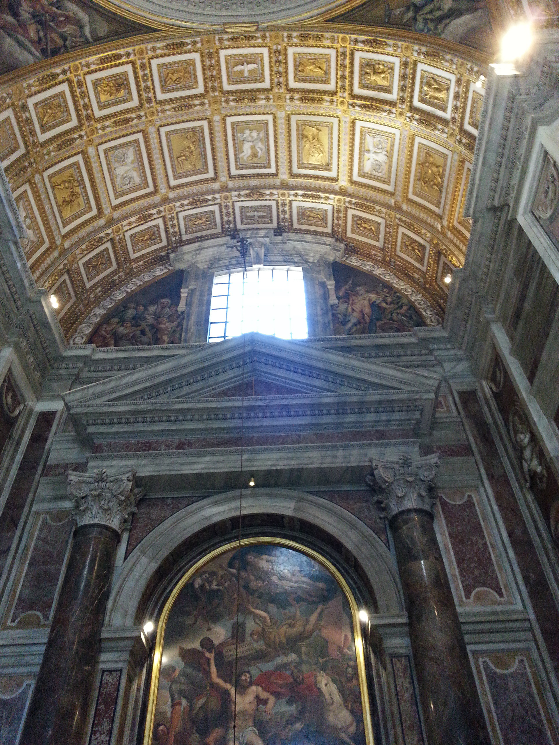 View of the ornamented domes and ceilings of the Basilica di San Pietro church in the Vatican. 