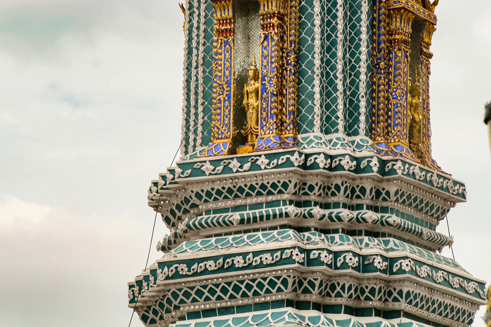Four Towers Called Prangs or Chedi at Grand Palace in Bangkok, Thailand
