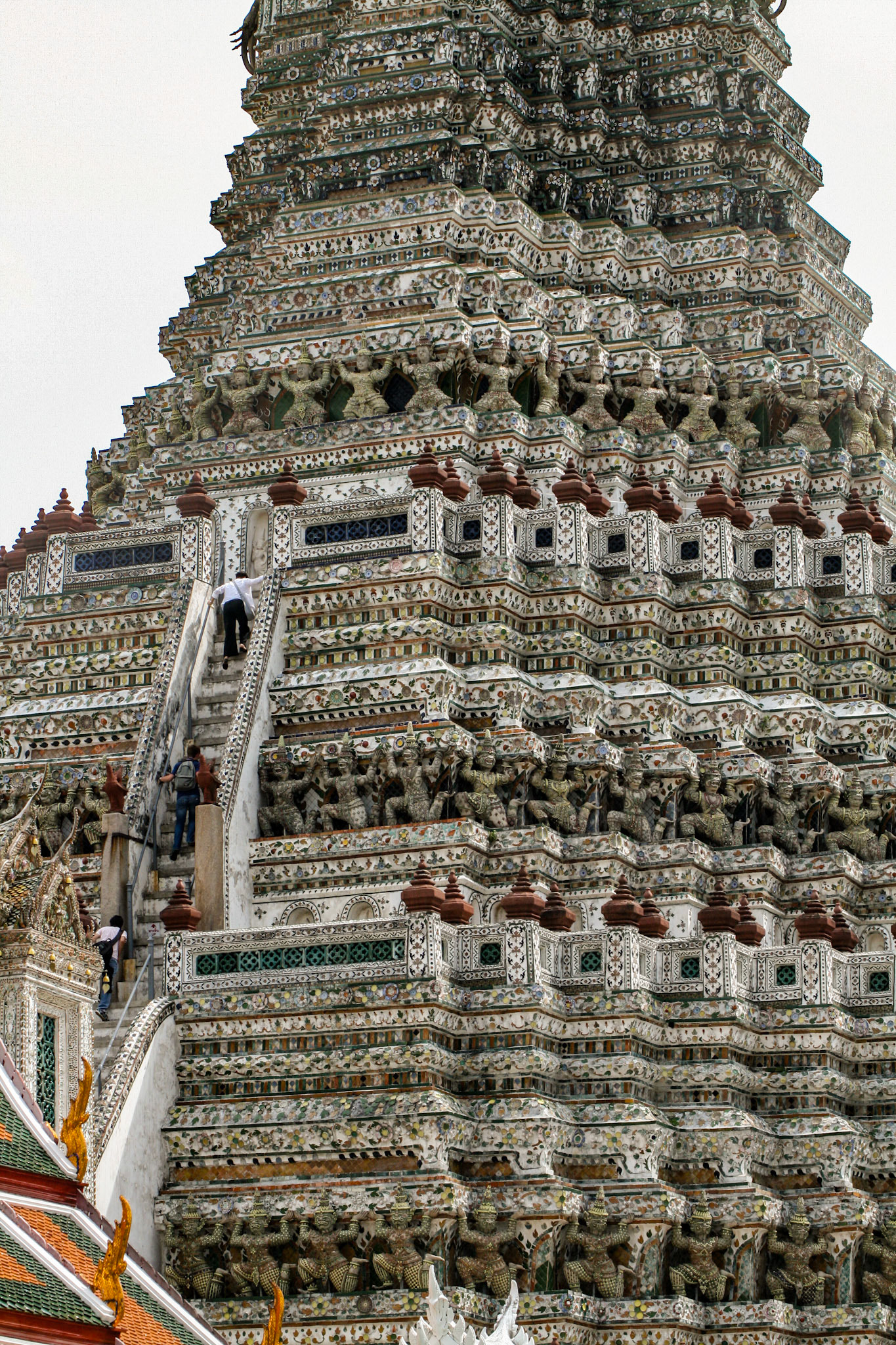The scale of these temples is so immense, people are dwarfed by comparison. Wat Arun, Temple of Dawn, Bangkok, Thailand 