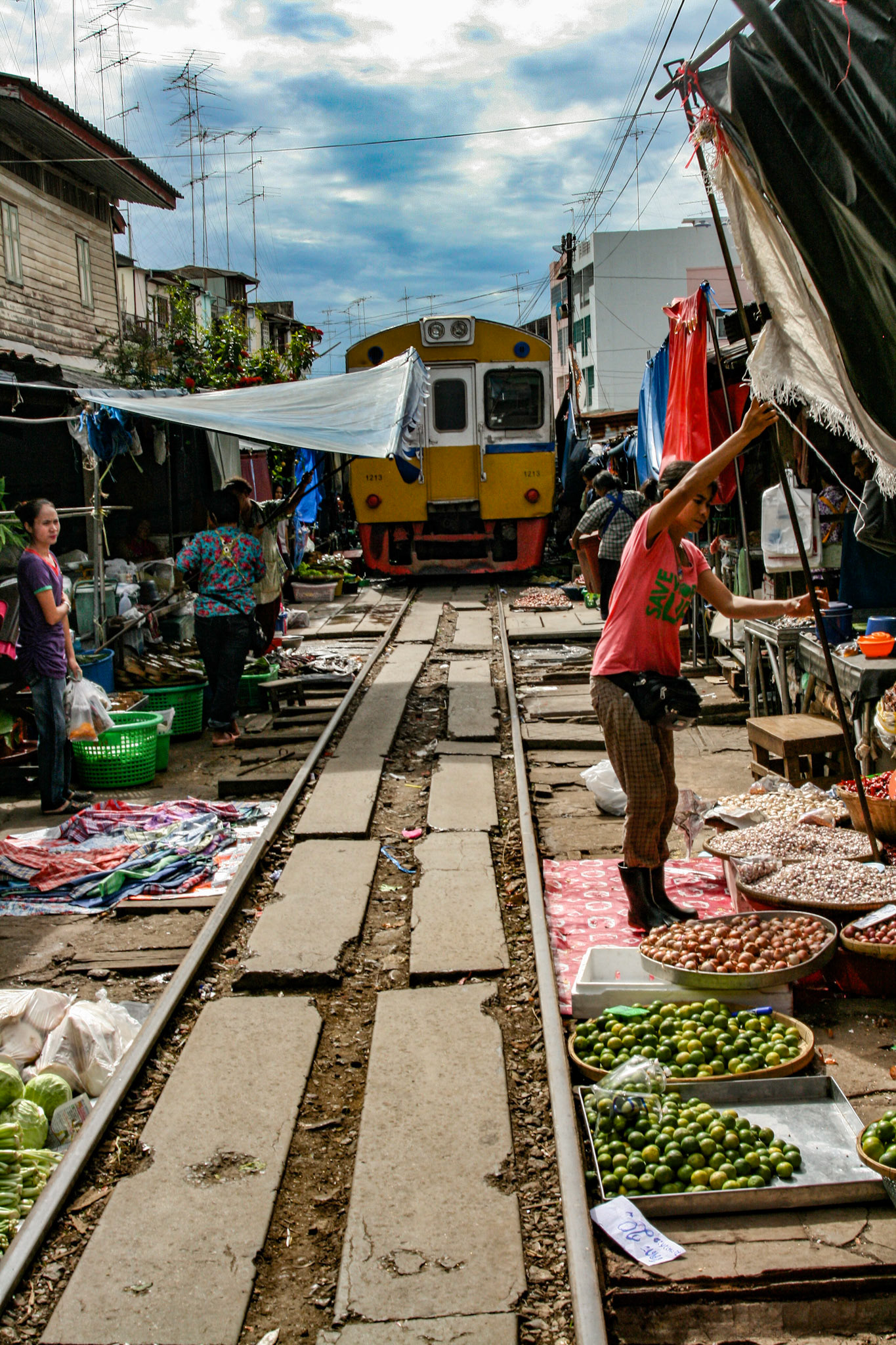 Once the train has passed, the vendors stretch out the awnings and everything goes back to business as usual.