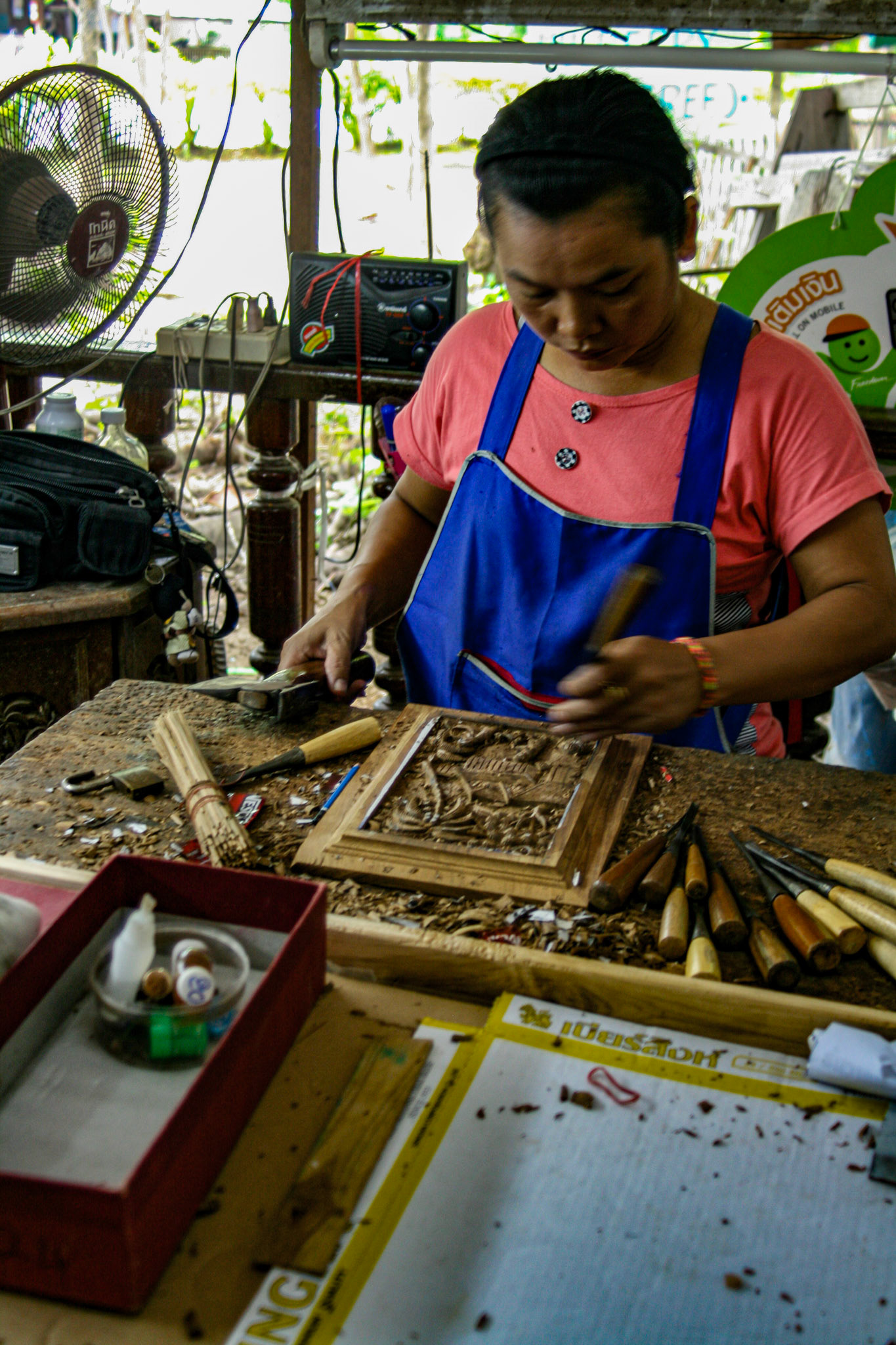 Wood carving at a Teakwood art factory.