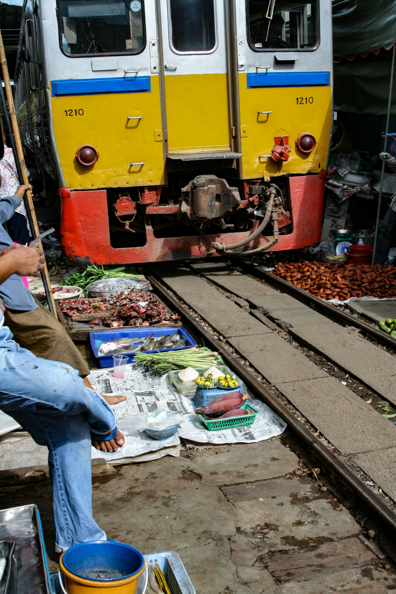 The train creeps by and brushes over any items left that just have enough clearance to avoid contact.