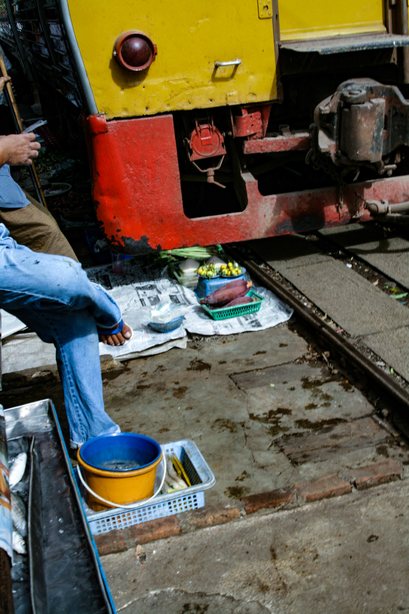 The train creeps by and brushes over any items left that just have enough clearance to avoid contact.