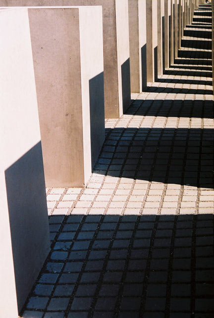 The narrow alleys and undulating ground, along with the gradual increase in height of the slabs as one enters the memorial, gives the impression of a gradual engulfing into an eventuality that is all too overwhelming. 