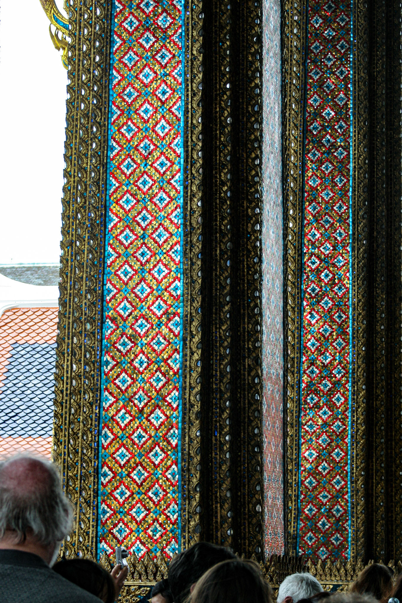 Intricate tilework on columns of Wat Phra Kaew