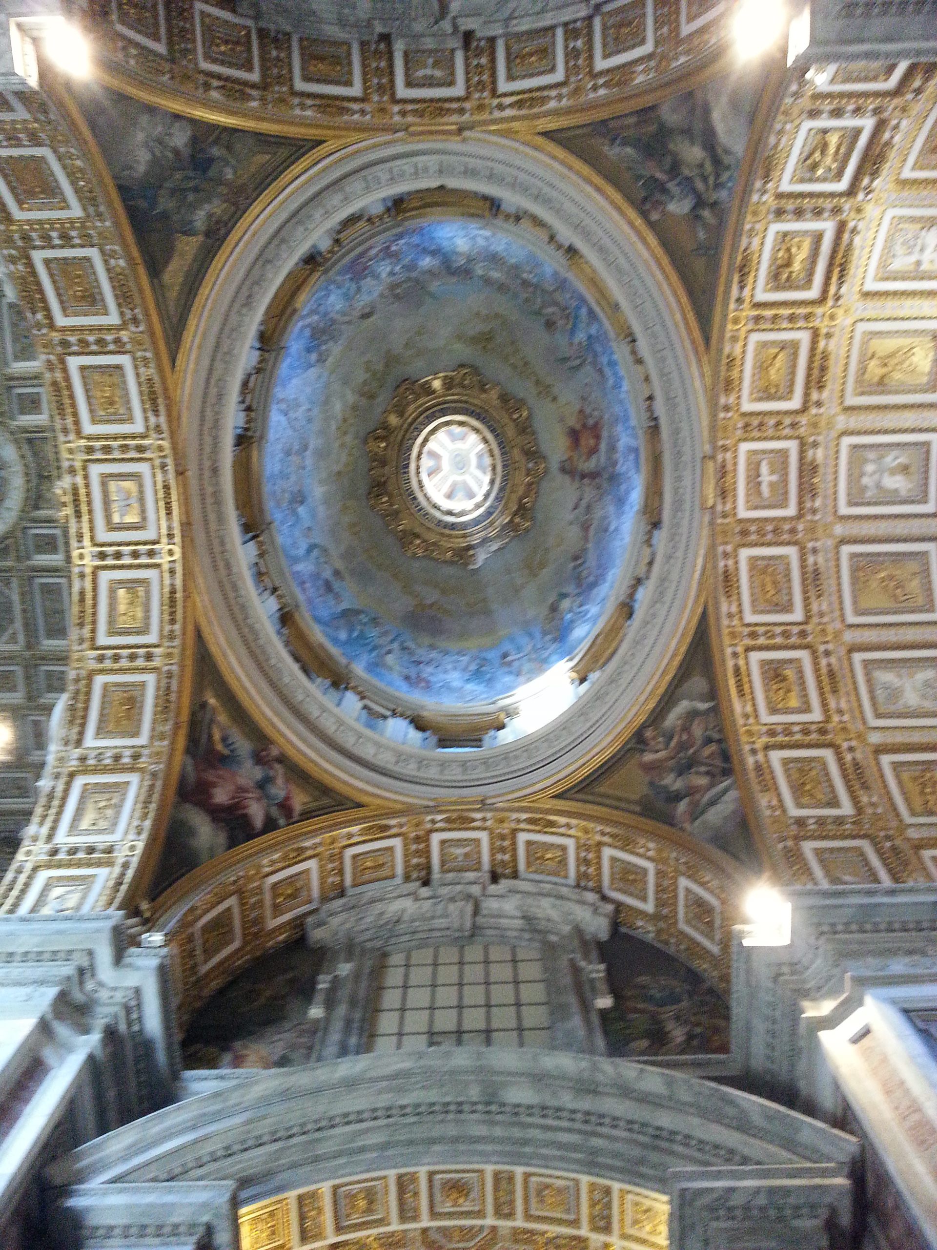 View of the ornamented domes and ceilings of the Basilica di San Pietro church in the Vatican. 