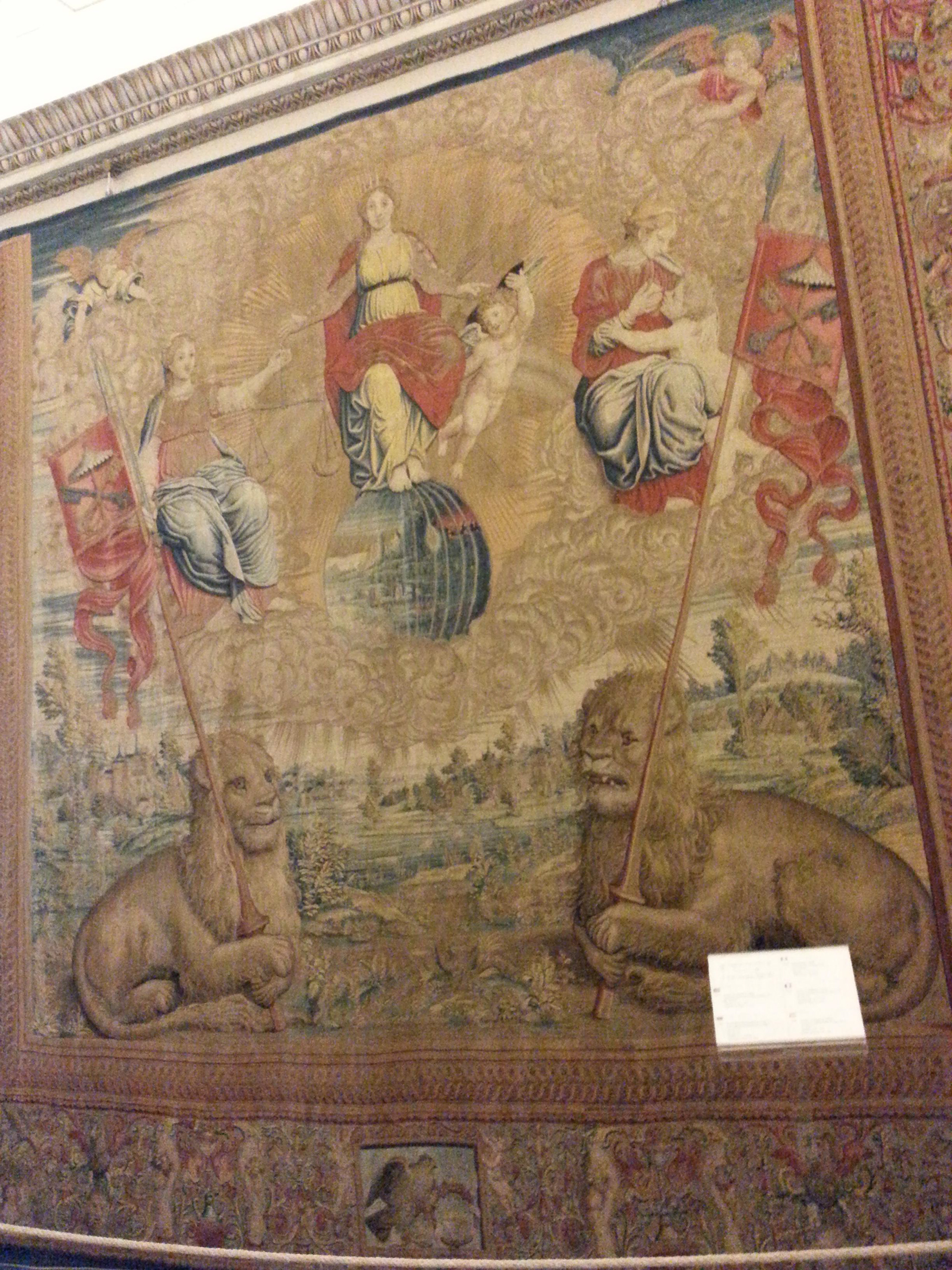 In the Gallery of San Pio V on the right “Two tapestries with Coronation of Mary” from cartoons by the Raphael school and “Religion, Justice and Charity” 1525 by Pieter van Aelst's manufacture 