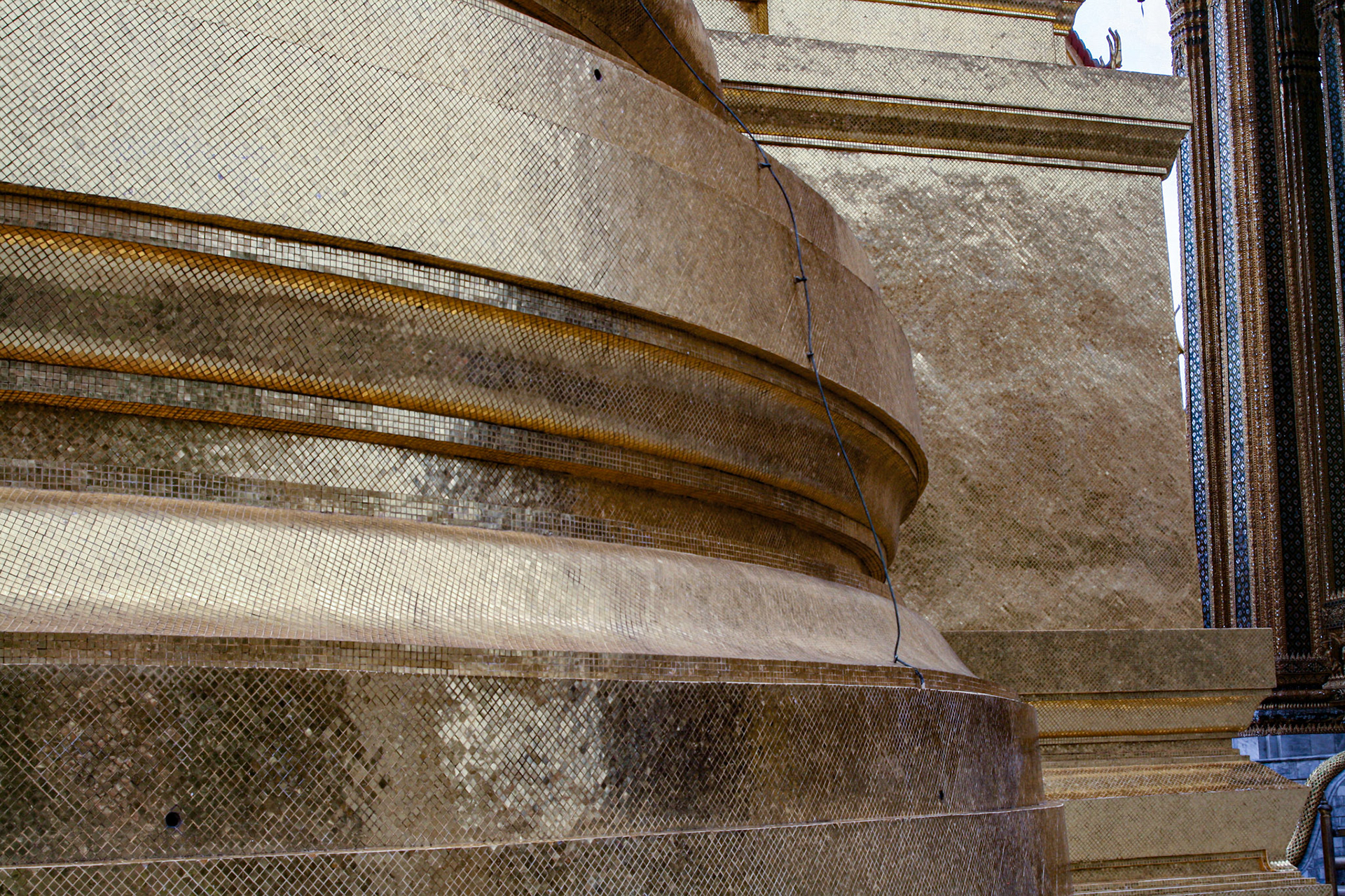 Architectural detail - Golden Stupa base showing intricate tilework.