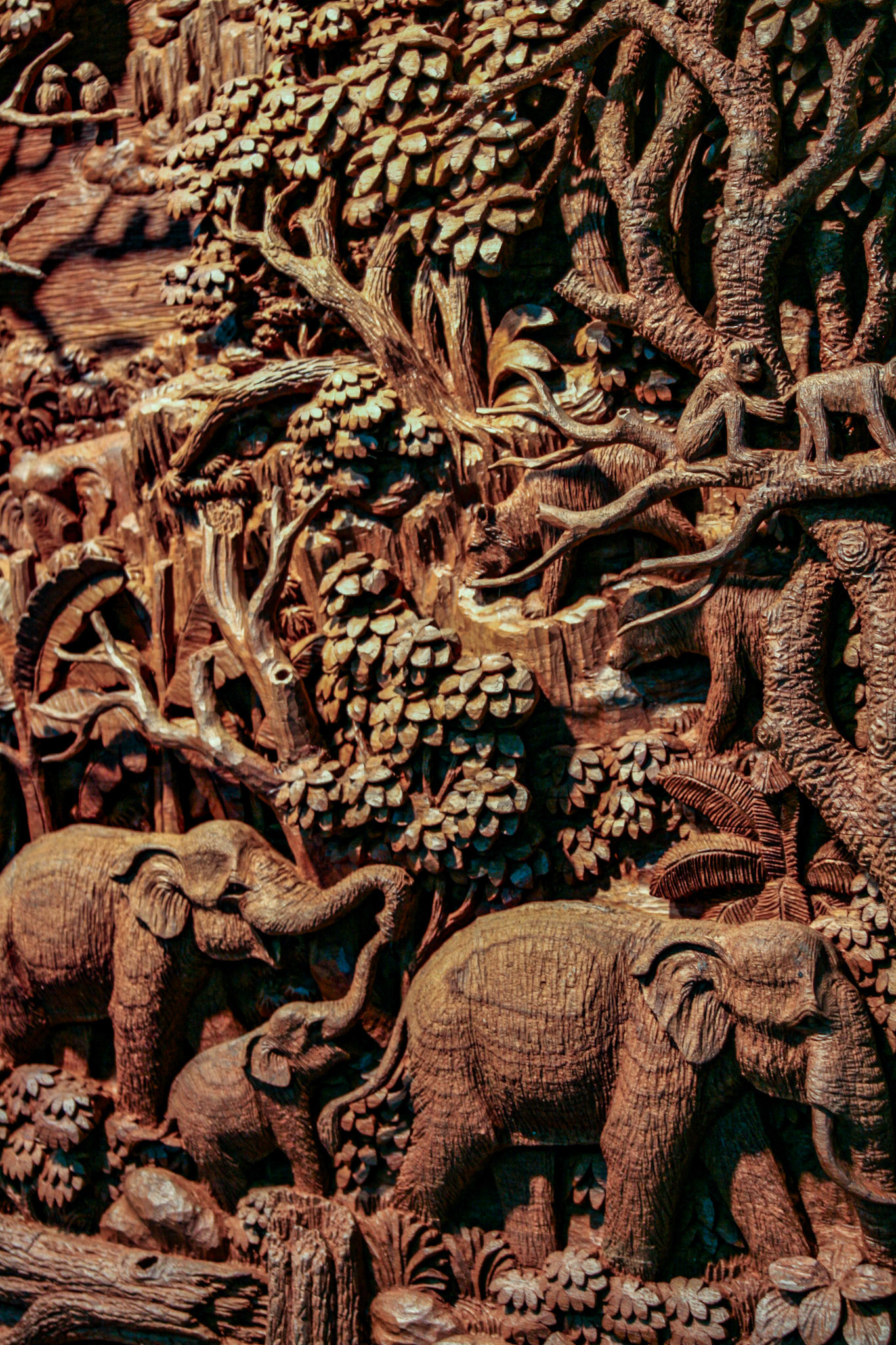 Wood carving at a Teakwood art factory.