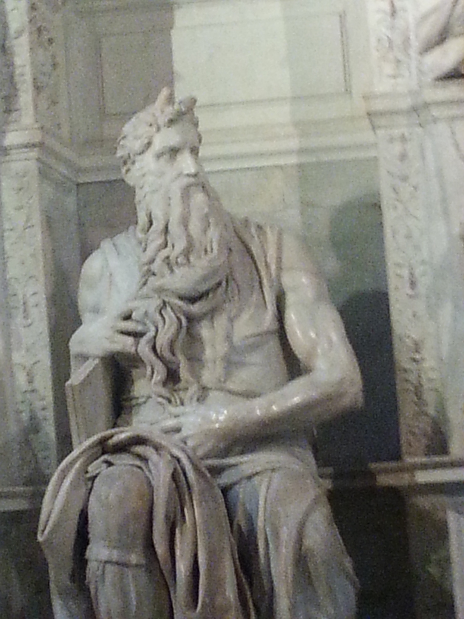 Moses (Italian: Mosè c. 1513–1515) is a sculpture by the Italian High Renaissance artist Michelangelo Buonarroti, housed in the church of San Pietro in Vincoli in Rome. Commissioned in 1505 by Pope Julius II for his tomb, it depicts the biblical figure Moses with horns on his head, based on a description in chapter 34 of Exodus in the Vulgate, the Latin translation of the Bible used at that time. 