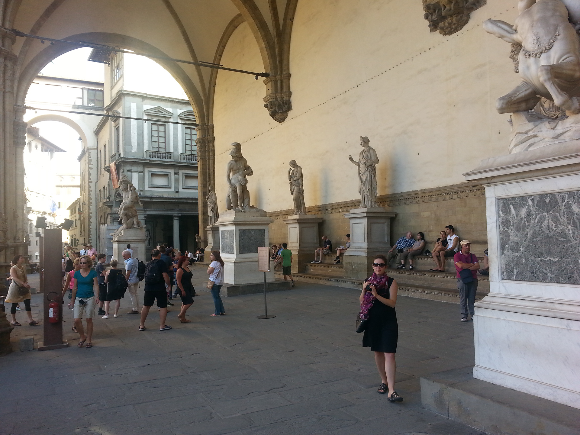 The graceful Loggia dei Lanzi, which sits to the right of Palazzo Vecchio and functions as an open-air sculpture gallery.