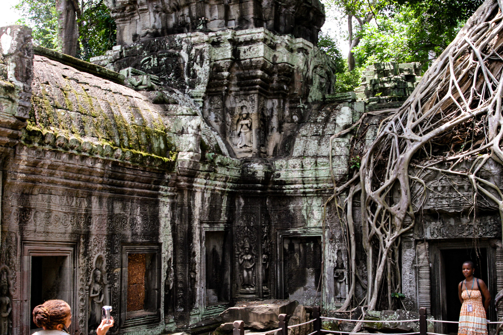 Ta Prohm Temple - Discovered deeply overgrown by jungle vegetation, some of the roots and trees have been left as they were found to maintain a picturesque “appearance of neglect.” 