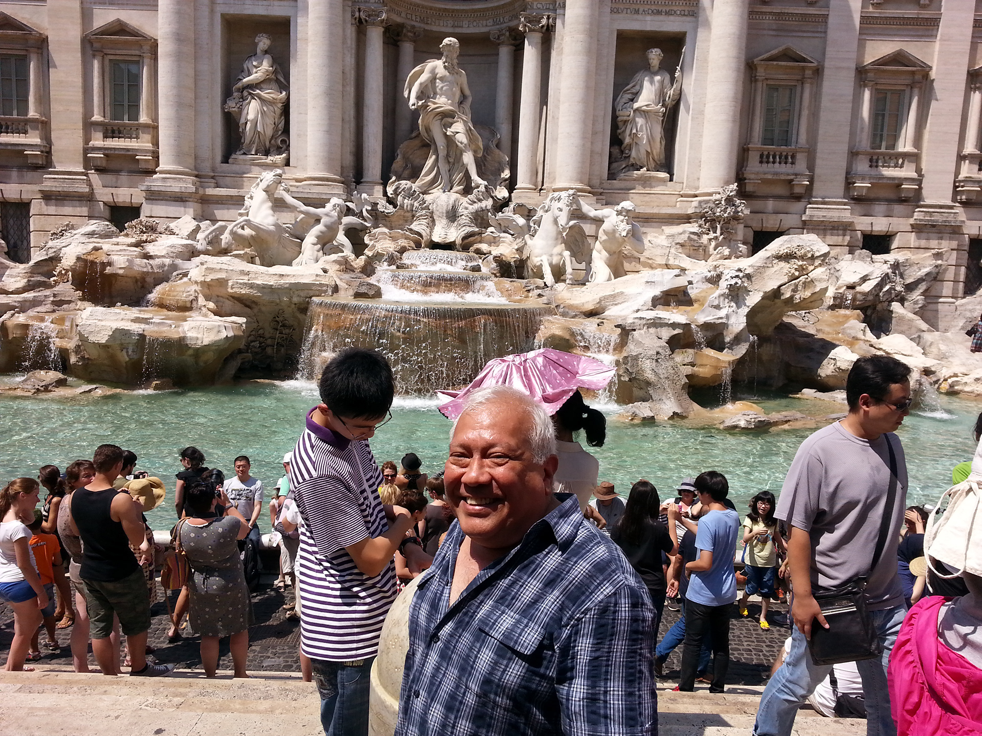 Sam Luna in front of Trevi Fountain.