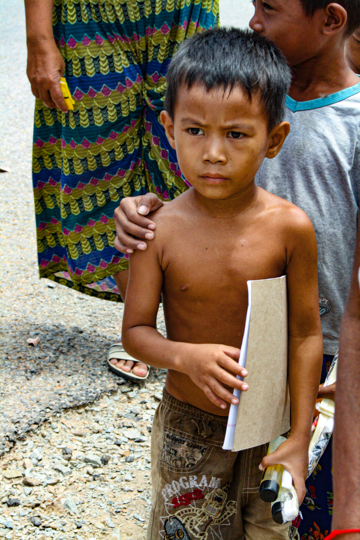 Our tour guide delivers varied and sundry gifts to some local villagers. Clothes, hygiene products, paper goods and other small items are among some of the items he collects for each time he visits. 