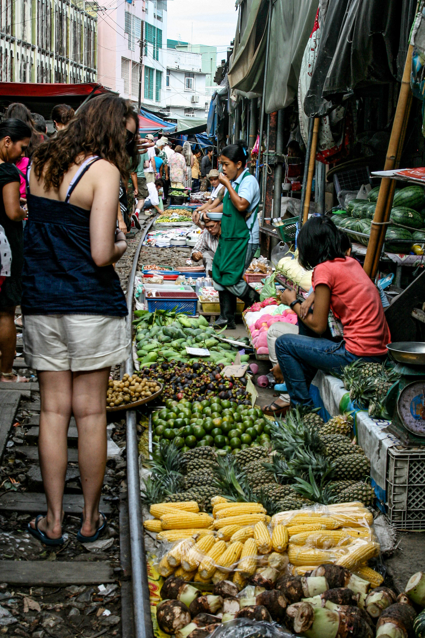Maeklong Railway Market, located in Samut Songkhram, Thailand, around 37 mi west of Bangkok, looks like any other open-air market in Asia except it has a train that runs through it.