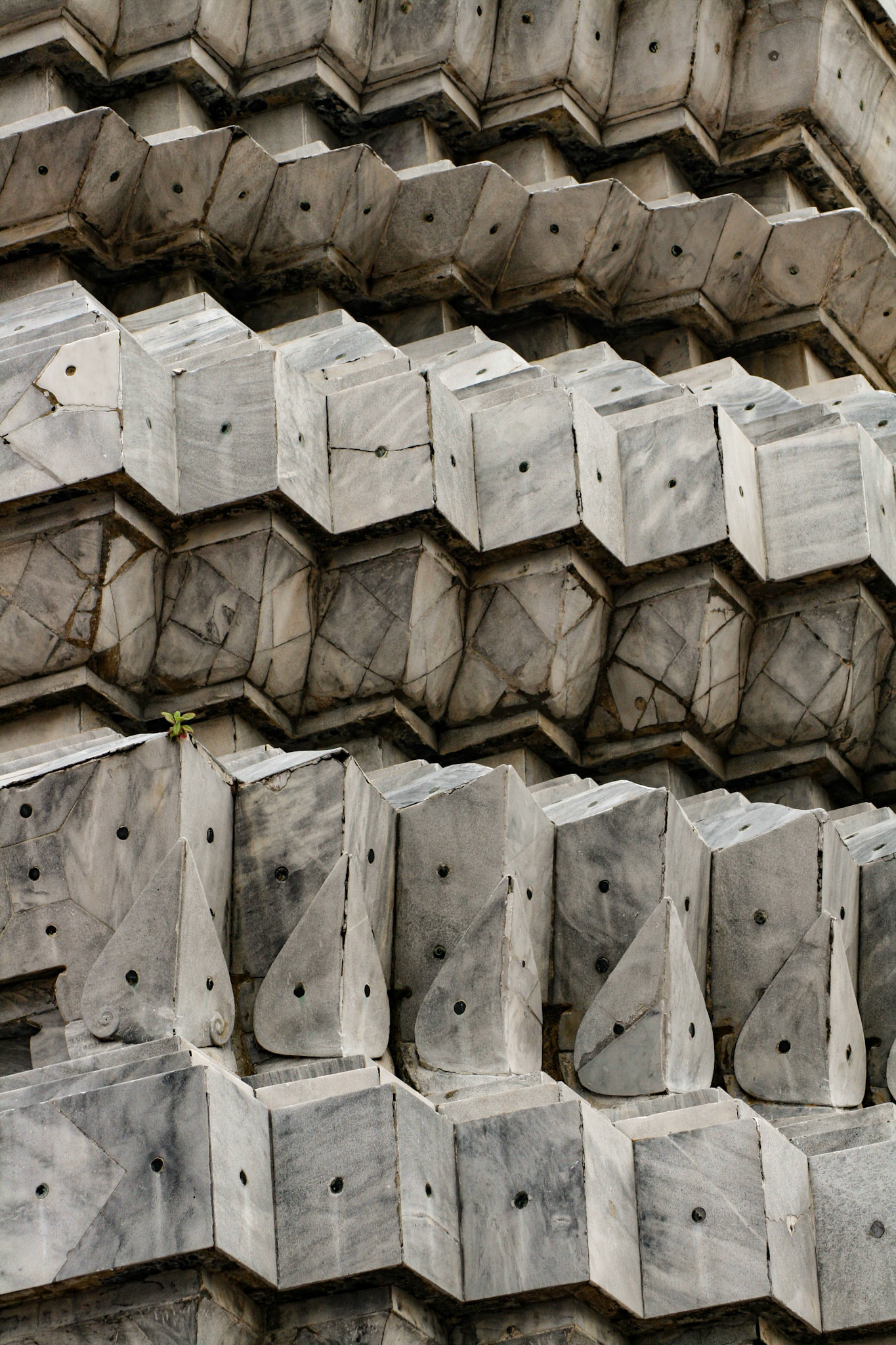 These stupas are different because they are covered in marble and they have gold leaf Khmer style statues.