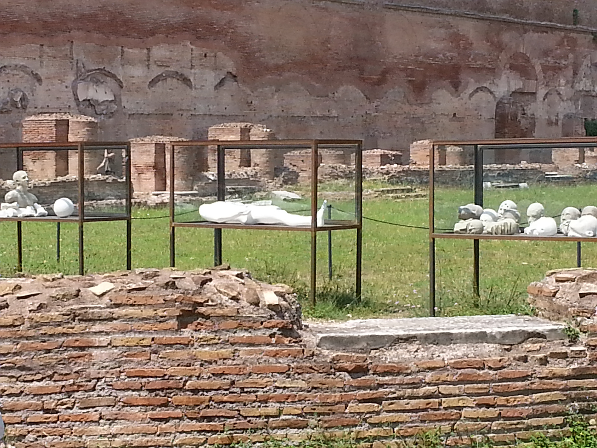 The Palatine Stadium was the third part of Domitian's palace on the Palatine Hill in Rome. It was the last to be built, after the Domus Flavia and the Domus Augustana, respectively the public and private parts of the complex. The stadium was a circus -shaped building, with a very elongated rectangle with a curved shorter side (the southern one) of about 160 x 48 meters. It occupies the entire eastern side of the Domus Augustana, for a total of about 88 meters. The perimeter was decorated by a two-story portico, composed on the lower level by brick pillars covered with marble (only the bases remain) and on the upper level by marble columns, as can be seen in part in the reconstruction of the northern corner. 