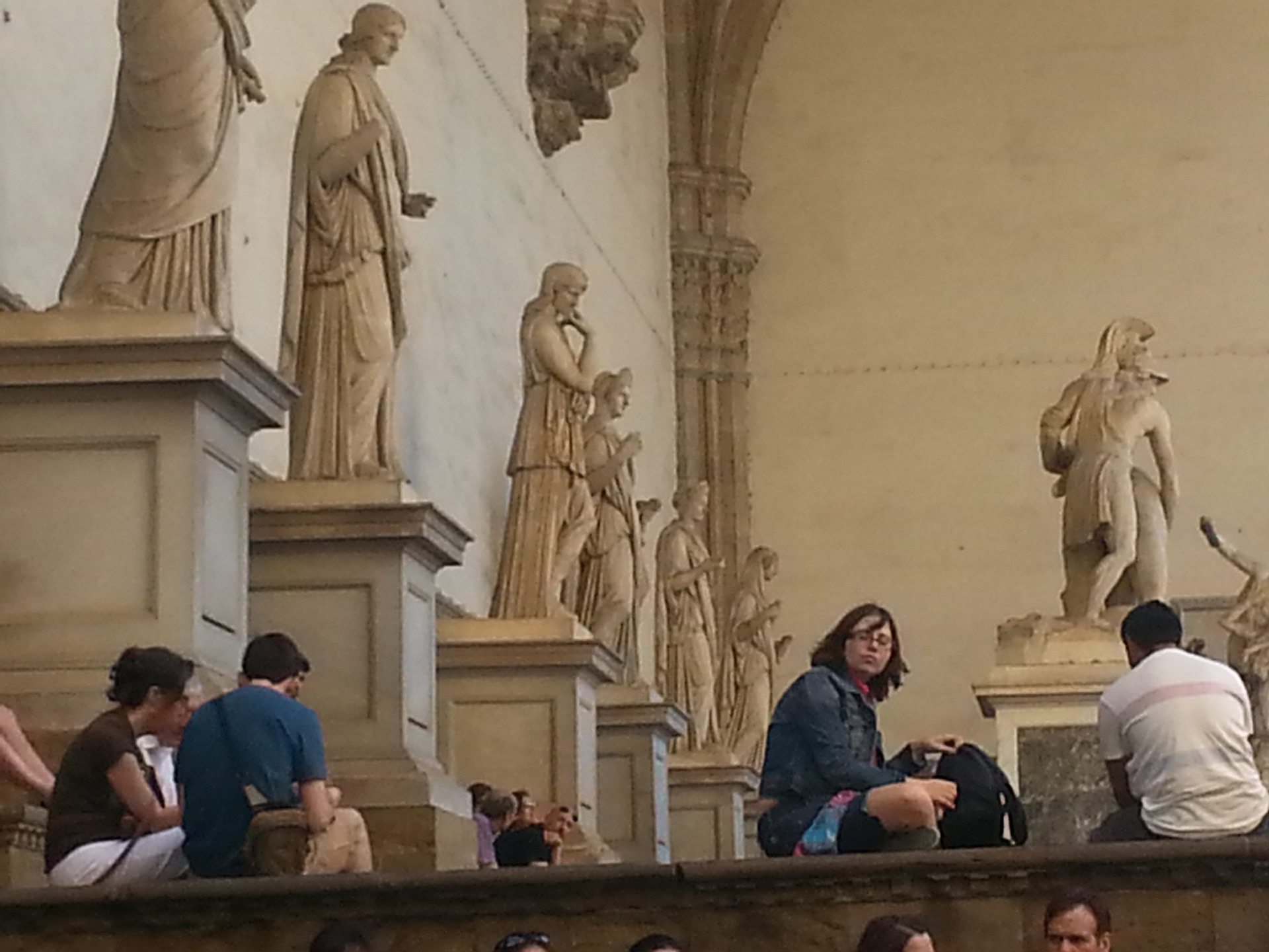 The graceful Loggia dei Lanzi, which sits to the right of Palazzo Vecchio and functions as an open-air sculpture gallery.