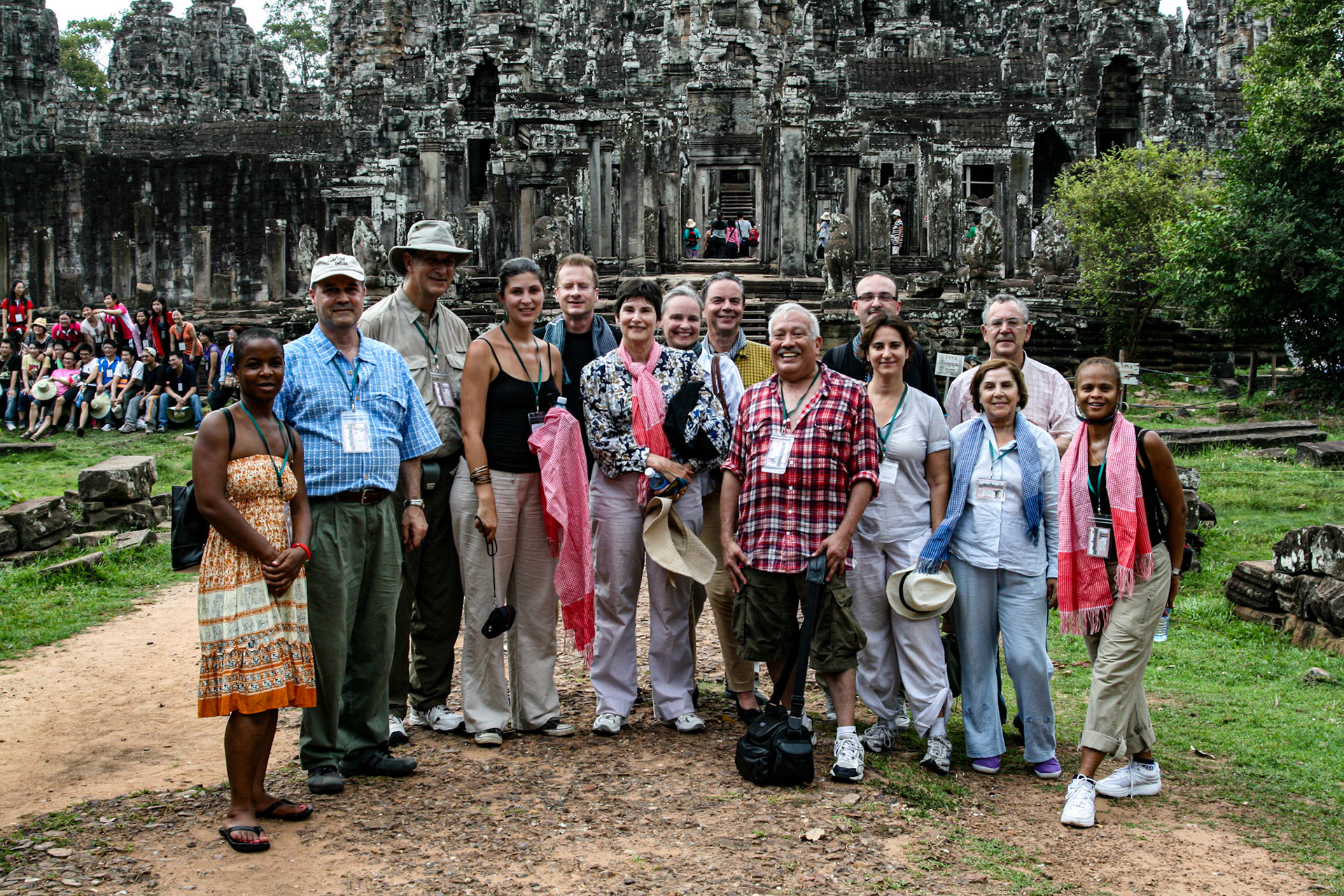 The ICA tour group stops for a pose in front of Bayon Temple.