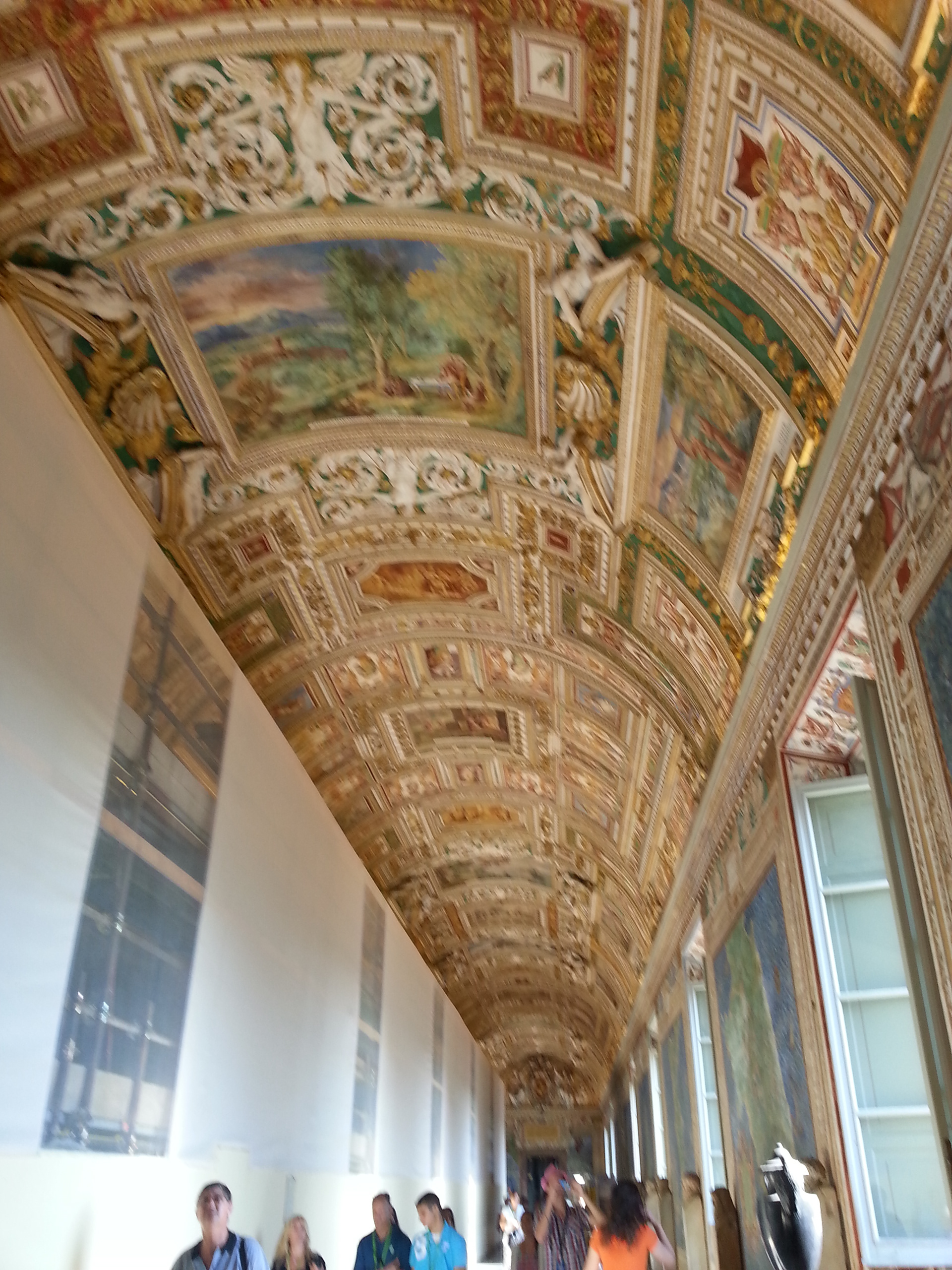  Even more than the ceiling's beautiful grandeur, the frescoes' symbolism and geographic placement within the great hall are astonishing. The fresco scenes that line the barrel-vaulted ceiling depict a variety of saints, apostles, martyrs, and other figures of Christianity. The figures within these frescoes can be linked to their location on the map, which is found on the wall just below the painting.