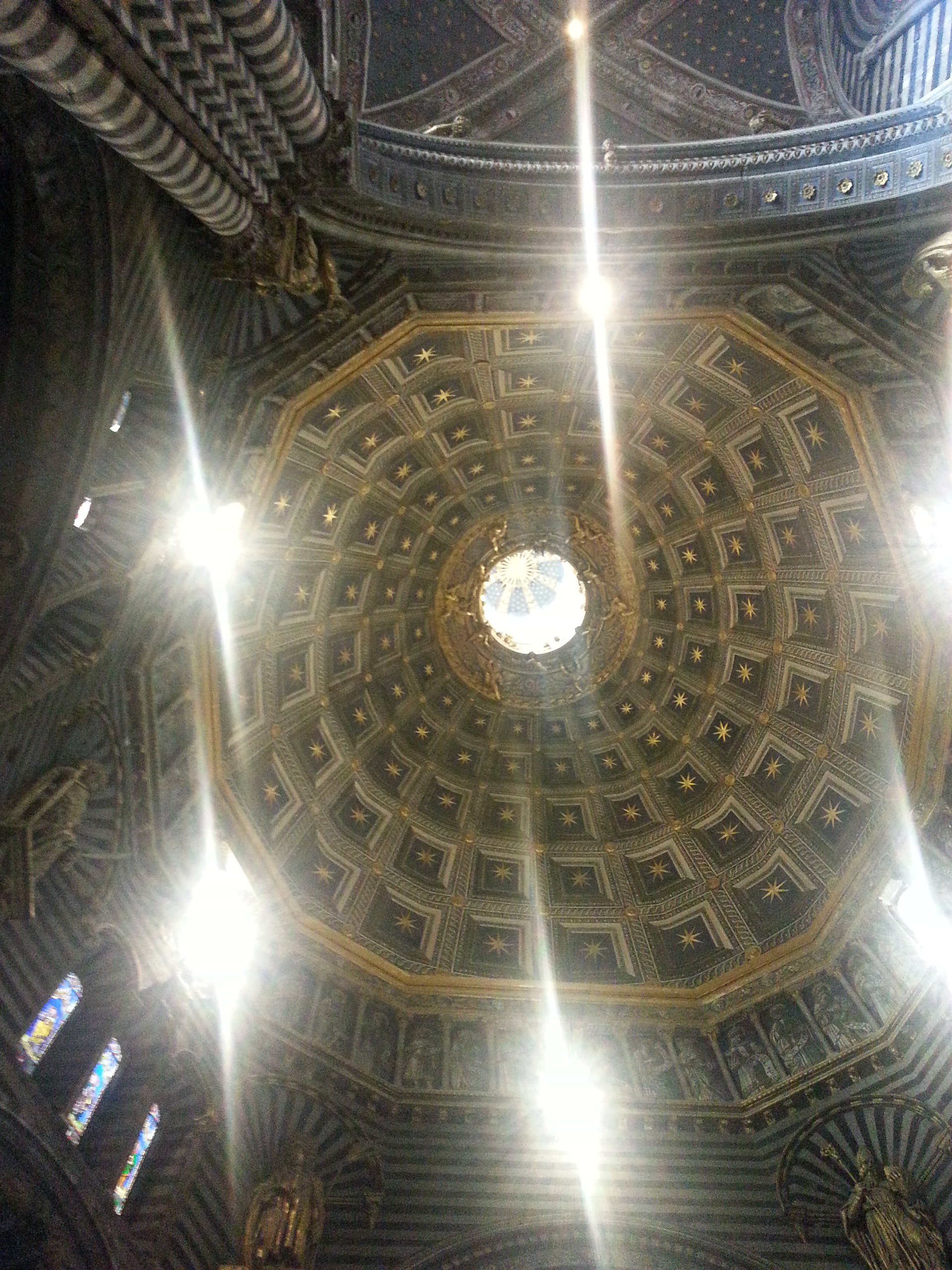 The ceiling is decorated with gold stars on a brilliant blue background.
