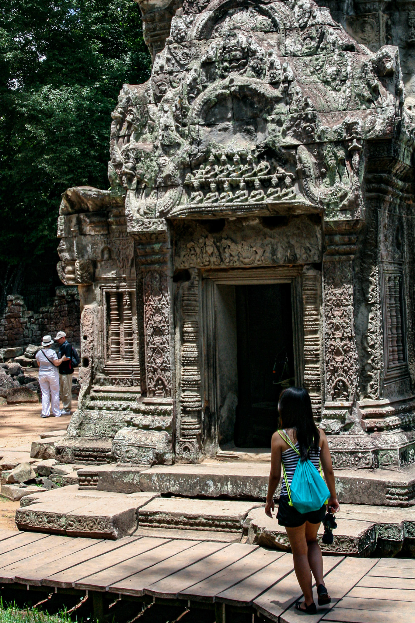 Bas relief above carved stone entrance at Ta Prohm temple.