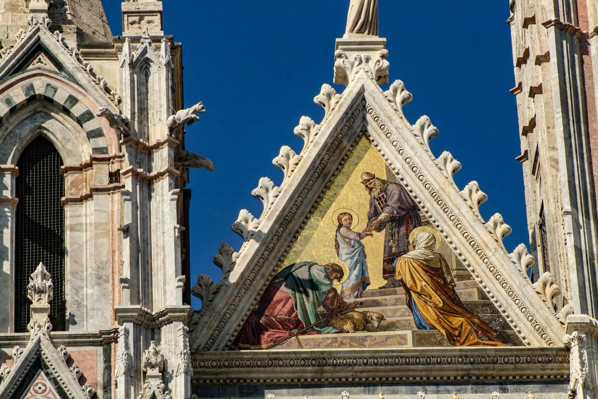 "Presentation of Mary in the Temple" gable mosaic on facade of Duomo di Siena (Siena Cathedral), Siena, Tuscany, Italy 