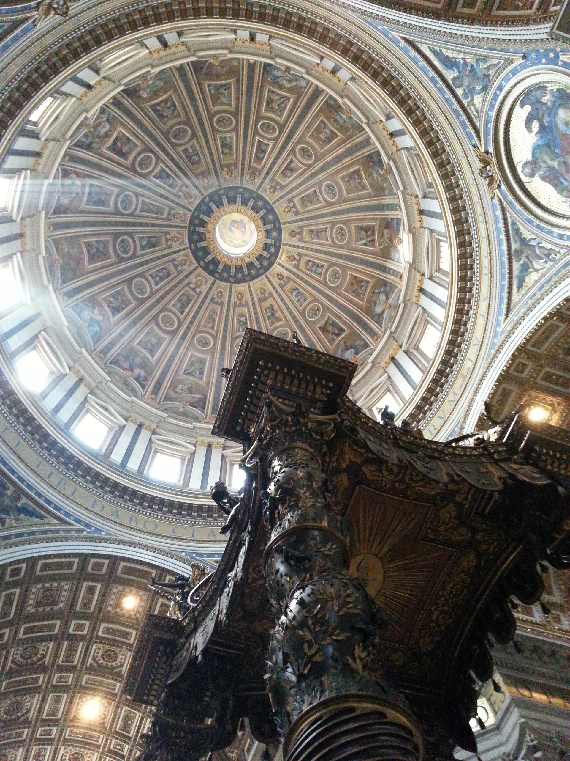 The baldachin acts as a visual focus within the basilica; it is itself a very large structure and forms a visual mediation between the enormous scale of the building and the human scale of the people officiating at the religious ceremonies at the papal altar beneath its canopy. 