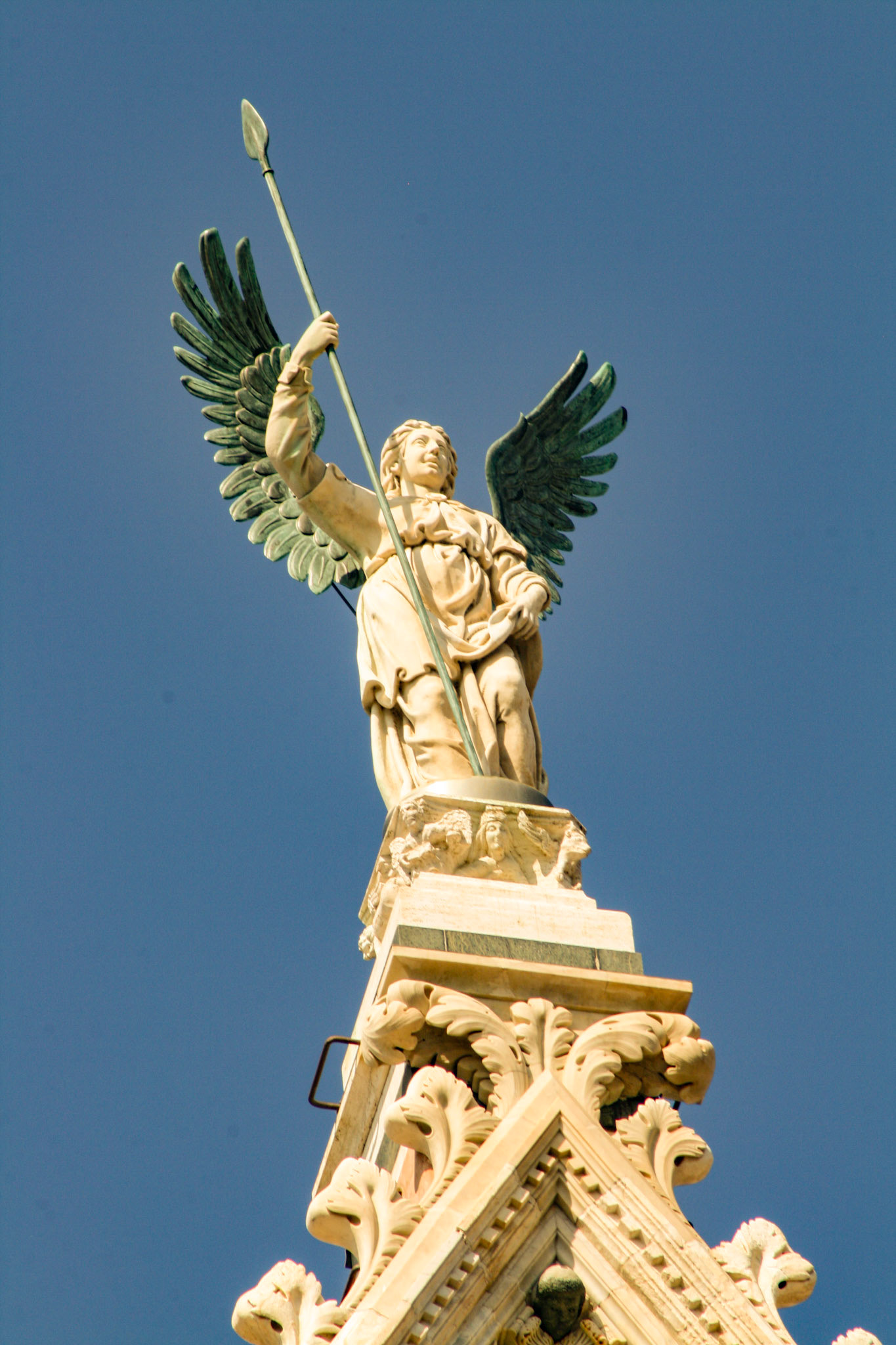 Michael, the archangel warrior perched atop the Duomo di Siena (Siena Cathedral), Siena, Tuscany, Italy 