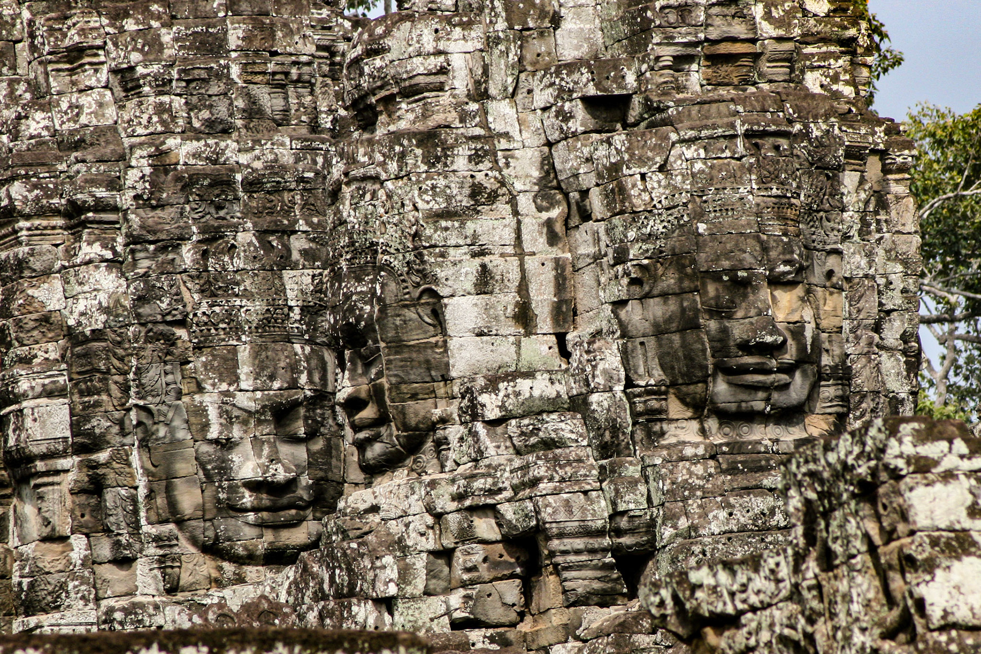 The Bayon is a richly decorated Khmer temple related to Buddhism at Angkor in Cambodia. Built in the late 12th or early 13th century as the state temple of the King Jayavarman VII), the Bayon stands at the center of Jayavarman's capital, Angkor Thom.