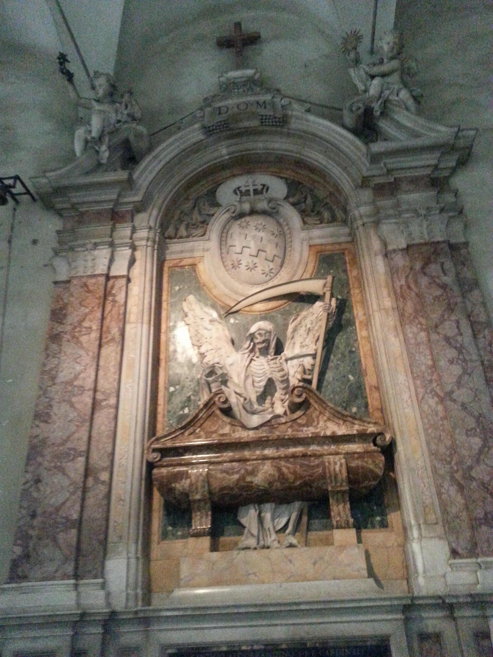 Tomb of Cardinal Cinzio Aldobrandini at Pietro in Vincoli in Rome, Italy. The marble frieze includes a grim reaper and human skeletons. 