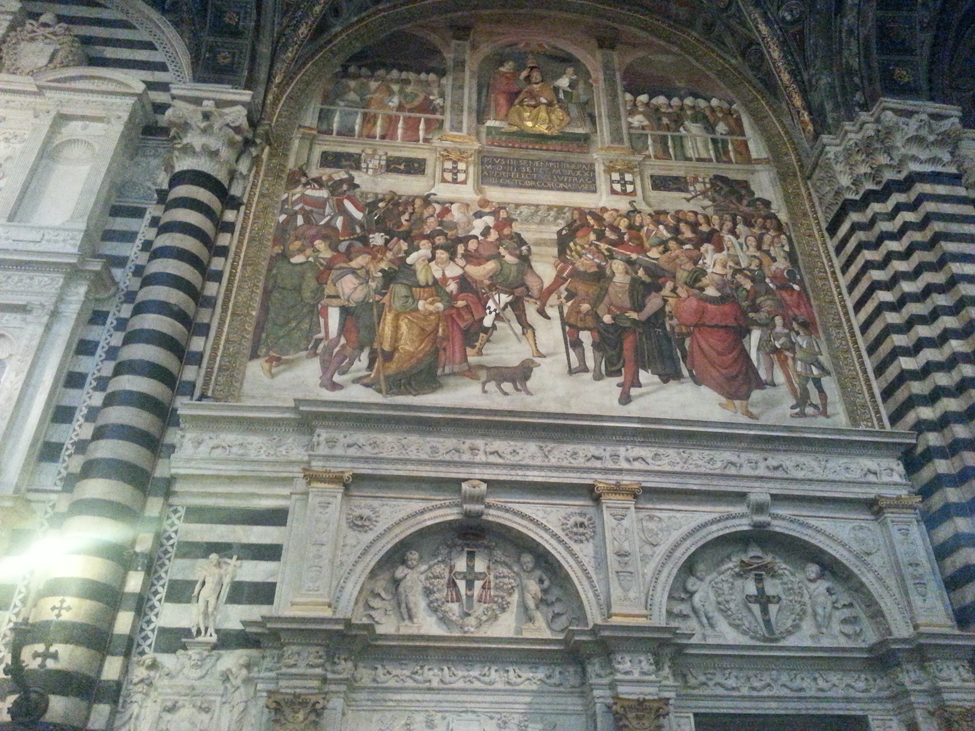 The Coronation of Pope Pius III - This fresco is on the entrance wall to the Piccolomini Library in the left aisle of the cathedral in Siena. 