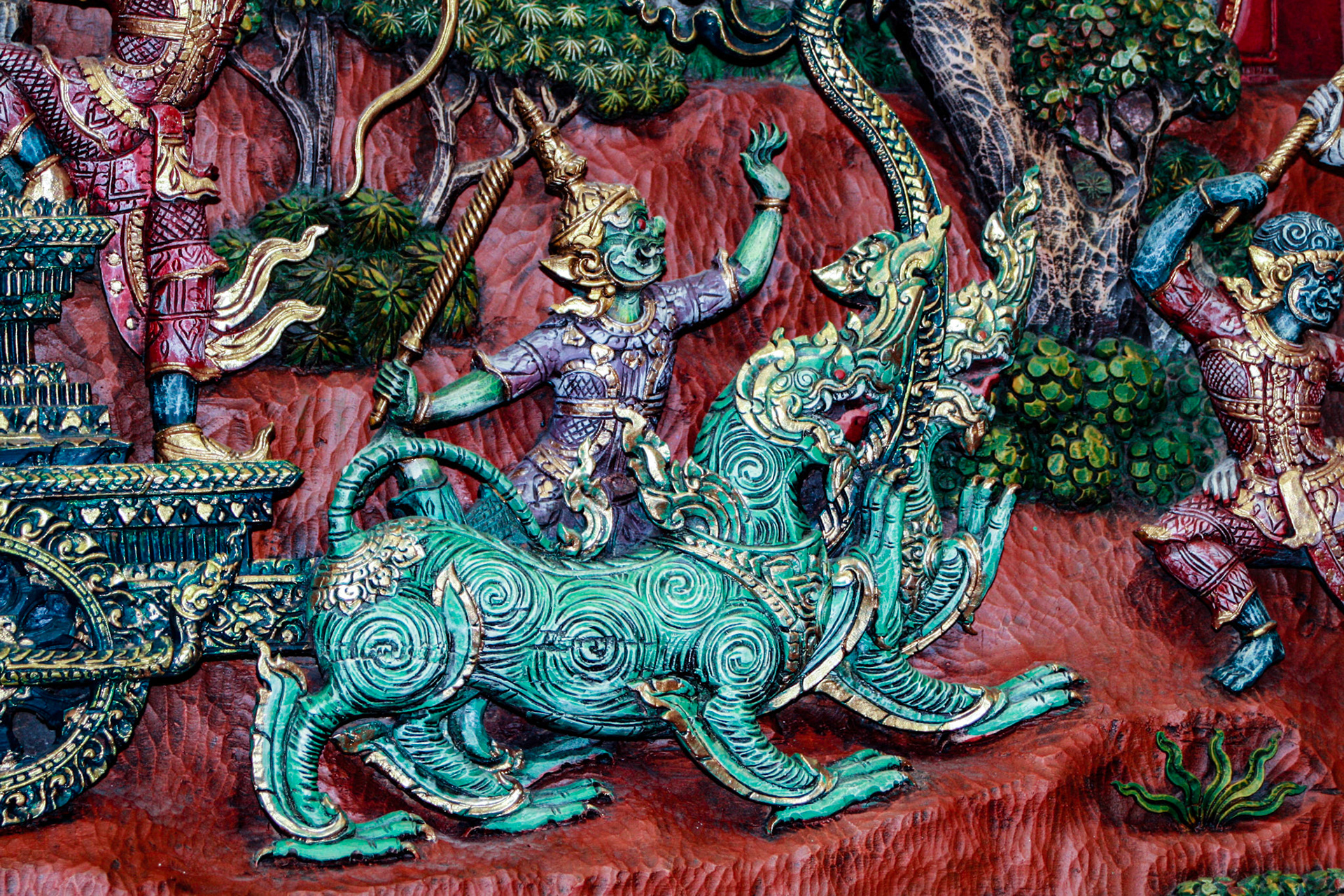 Wood carving at a Teakwood art factory.