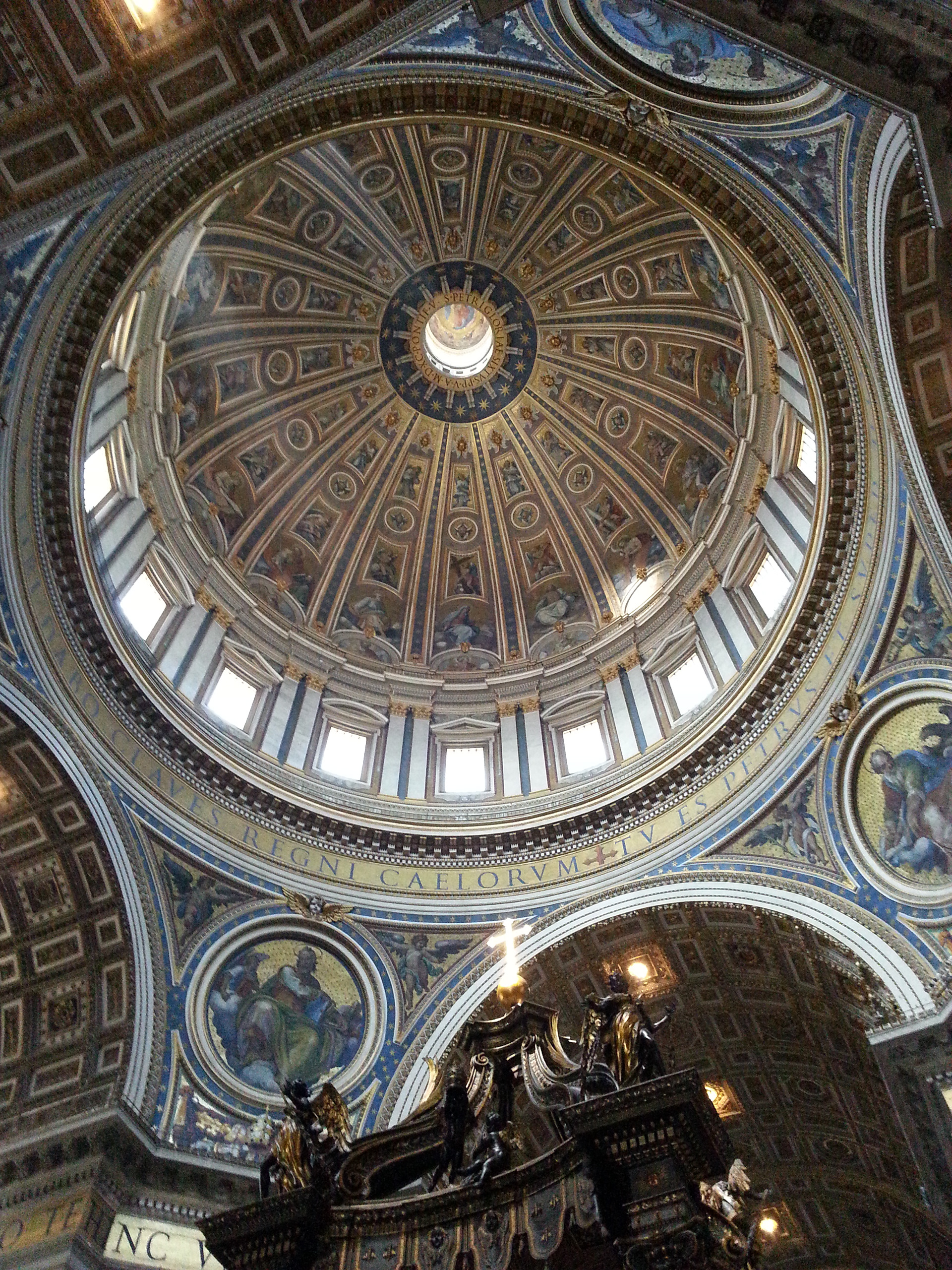 The baldachin is at the center of the crossing, and directly under the dome of the basilica. 