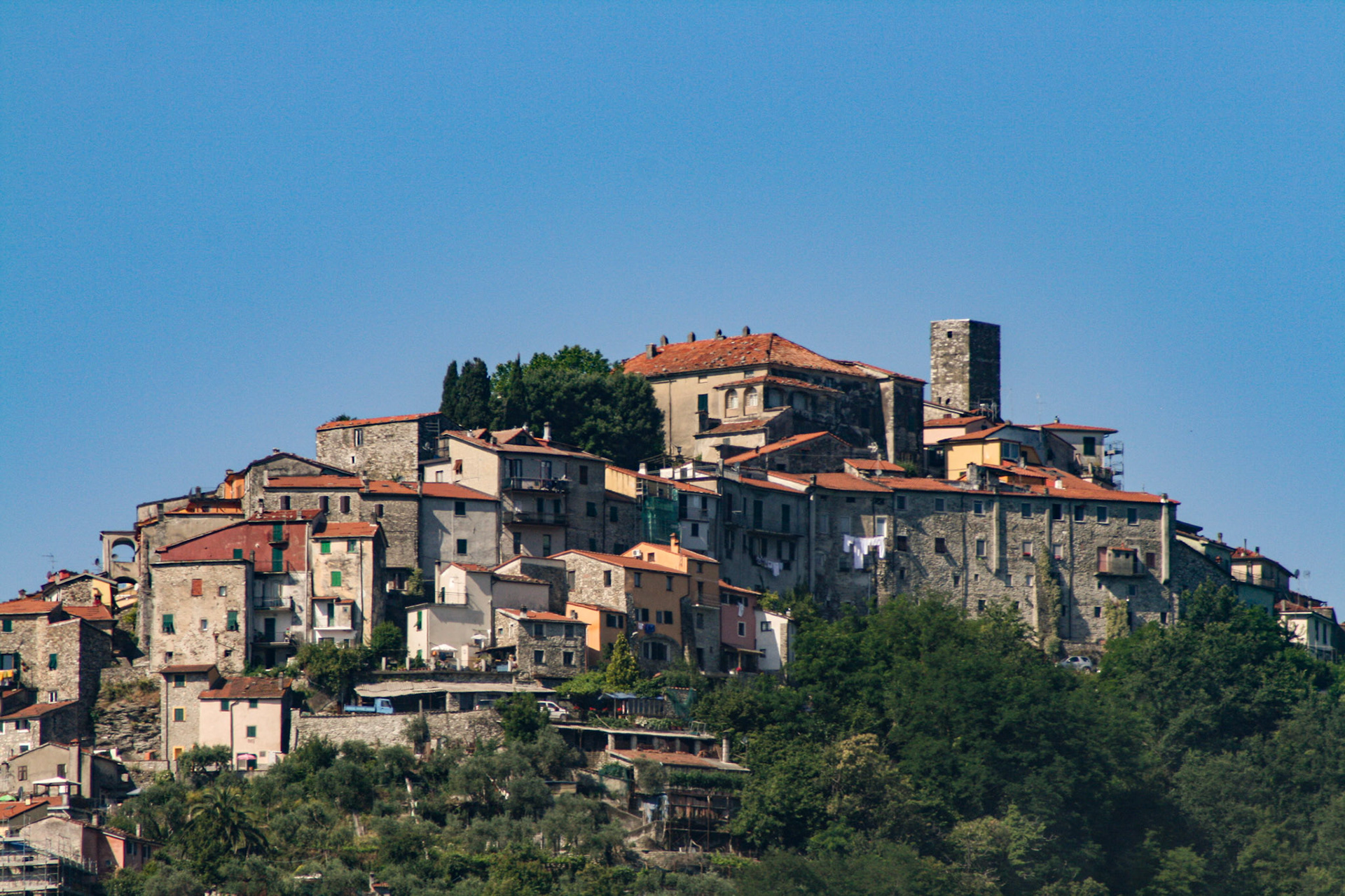 Ancient villages dot the mountainside as we travel towards Manarola, Cinque Terre, Italy. 