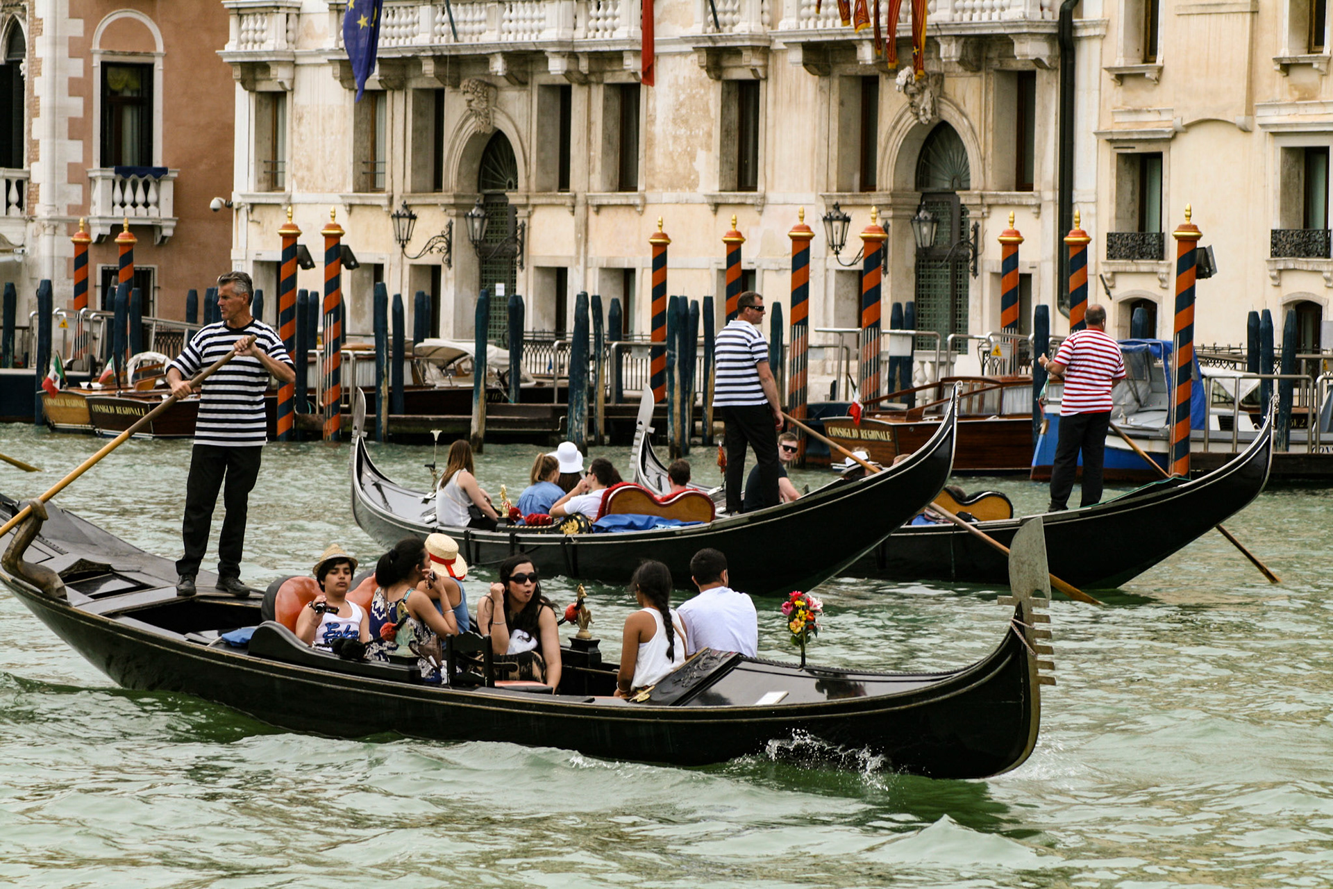 Gondoliers on the Grand Canal. - Venice