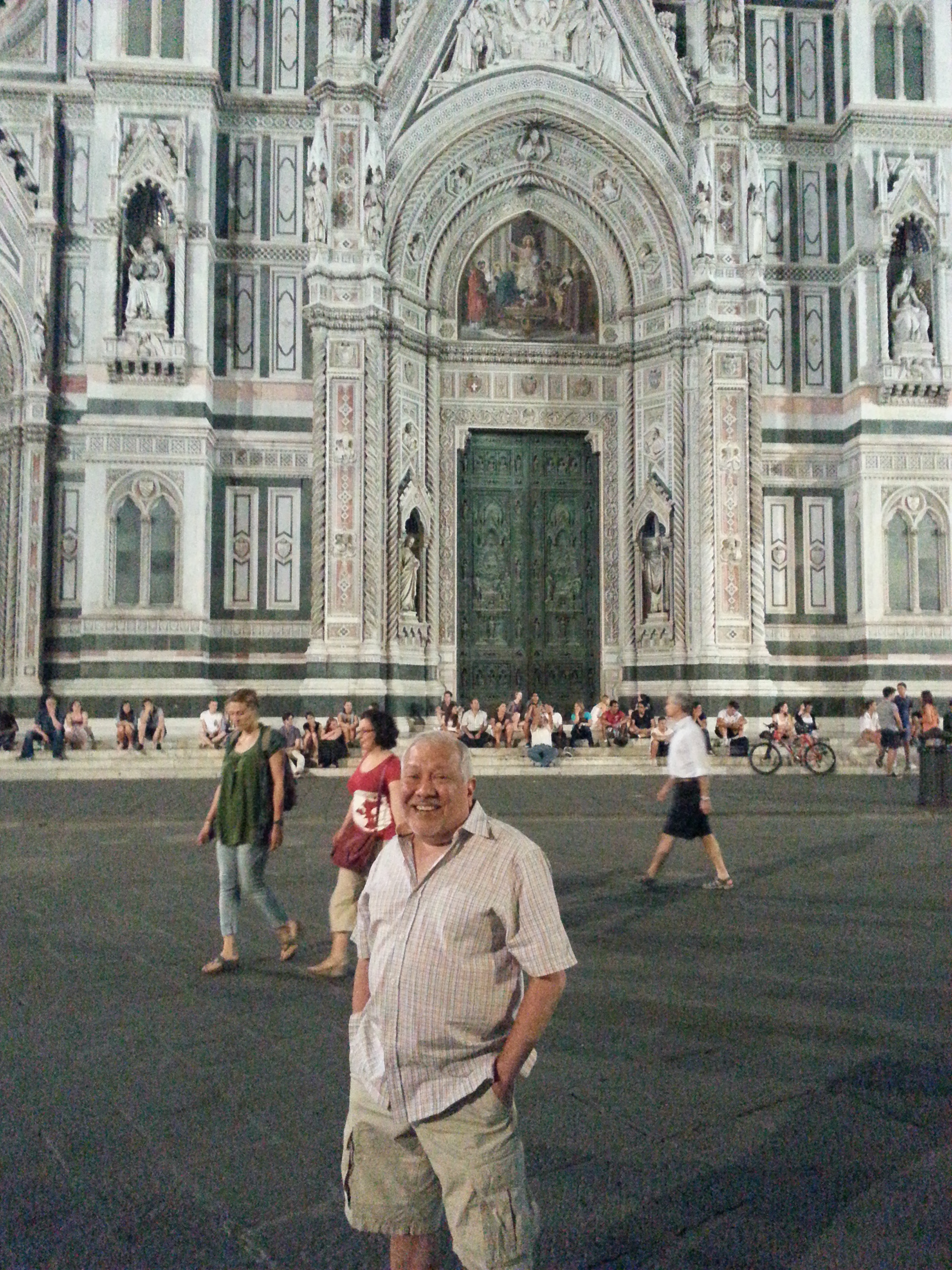 Sam Luna stands in front of the Cathedral of Saint Mary of the Flower, Florence, Tuscany, Italy.