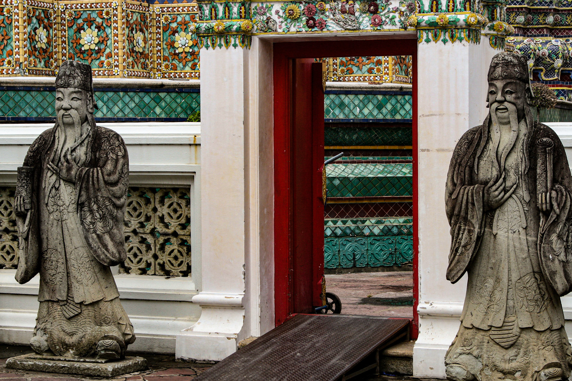 Guardian statues keep watch over a passageway.