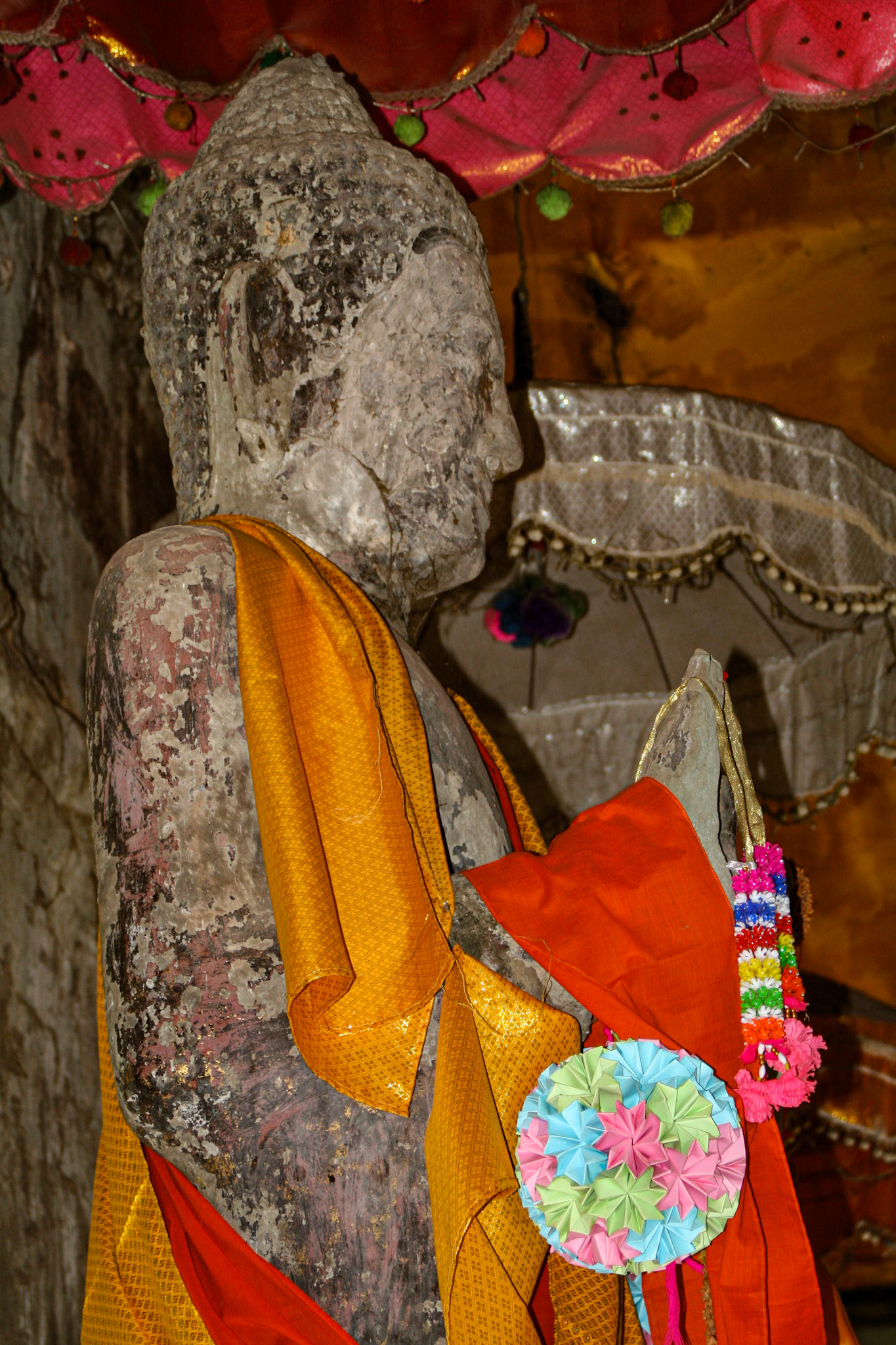 Buddhism proliferated in the Cambodian region during the 13th century. Gradually, it became the dominant religion of Cambodia and Angkor Wat, along with other Hindu monuments, were repurposed for Buddhist worship. Buddhist iconography was added alongside the existing Hindu symbols and sculptures of Buddha were erected. The temple continues to be used for Buddhist worship to this day. 