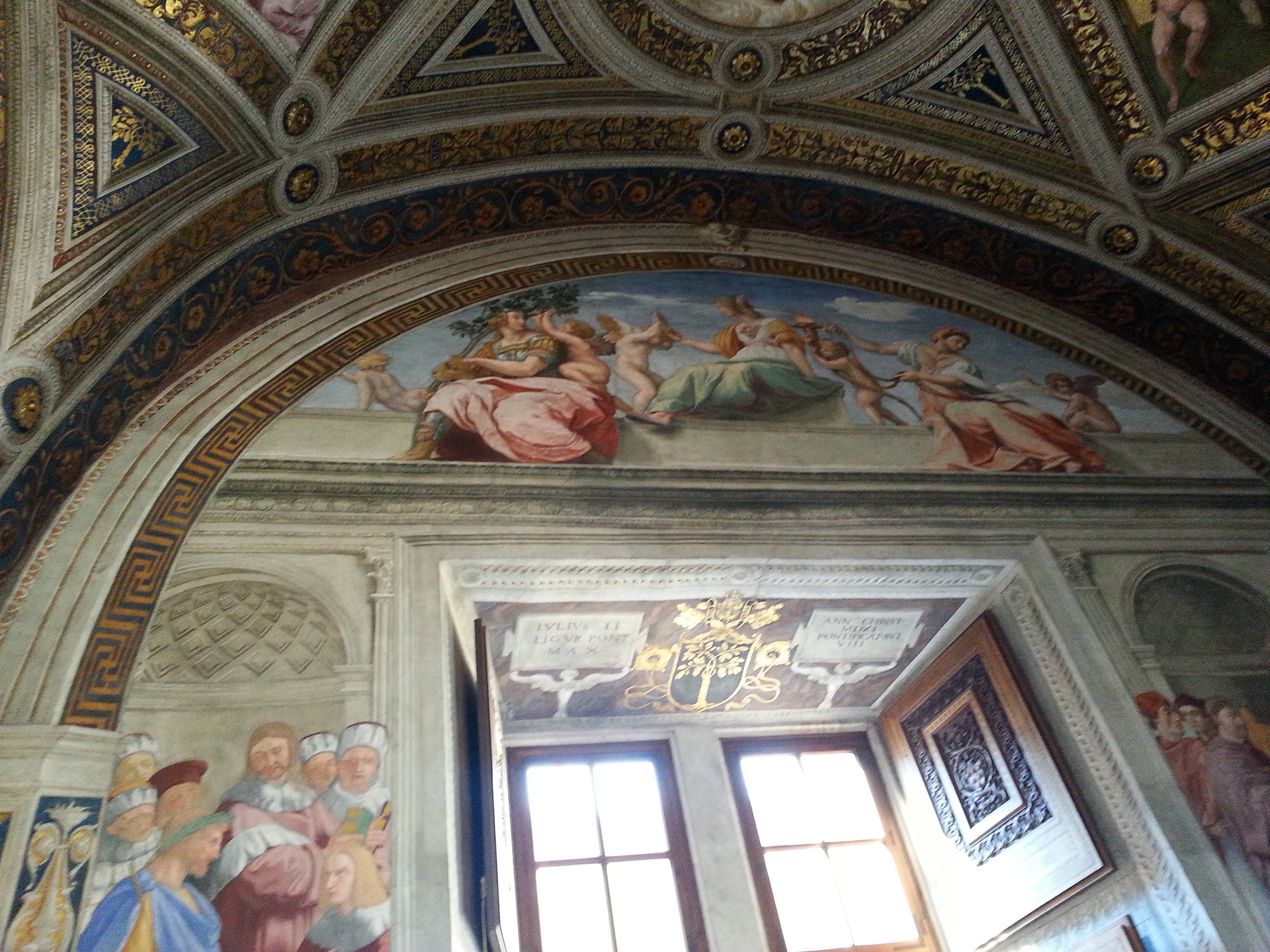 The Cardinal and Theological Virtues is a lunette fresco by Raphael found on the south wall of the Stanza della Segnatura in the Apostolic Palace of the Vatican. Three of the cardinal virtues are personified as statuesque women seated in a bucolic landscape and the theological virtues are depicted by putti. The fresco was a part of Raphael's commission to decorate the private apartments of Pope Julius II. These rooms are now known as the Stanze di Raffaello. After completing his three monumental frescoes Disputation of the Holy Sacrament, The Parnassus, and The School of Athens in the Stanza della Segnatura, Raphael painted the Cardinal and Theological Virtues in 1511. 